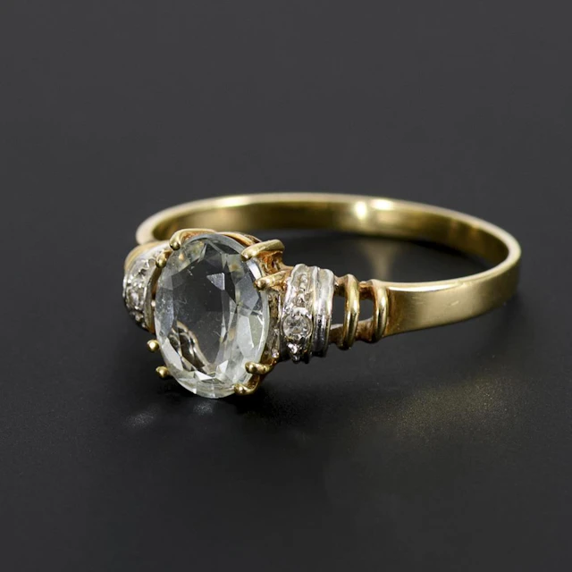 Ring with a blue gemstone.