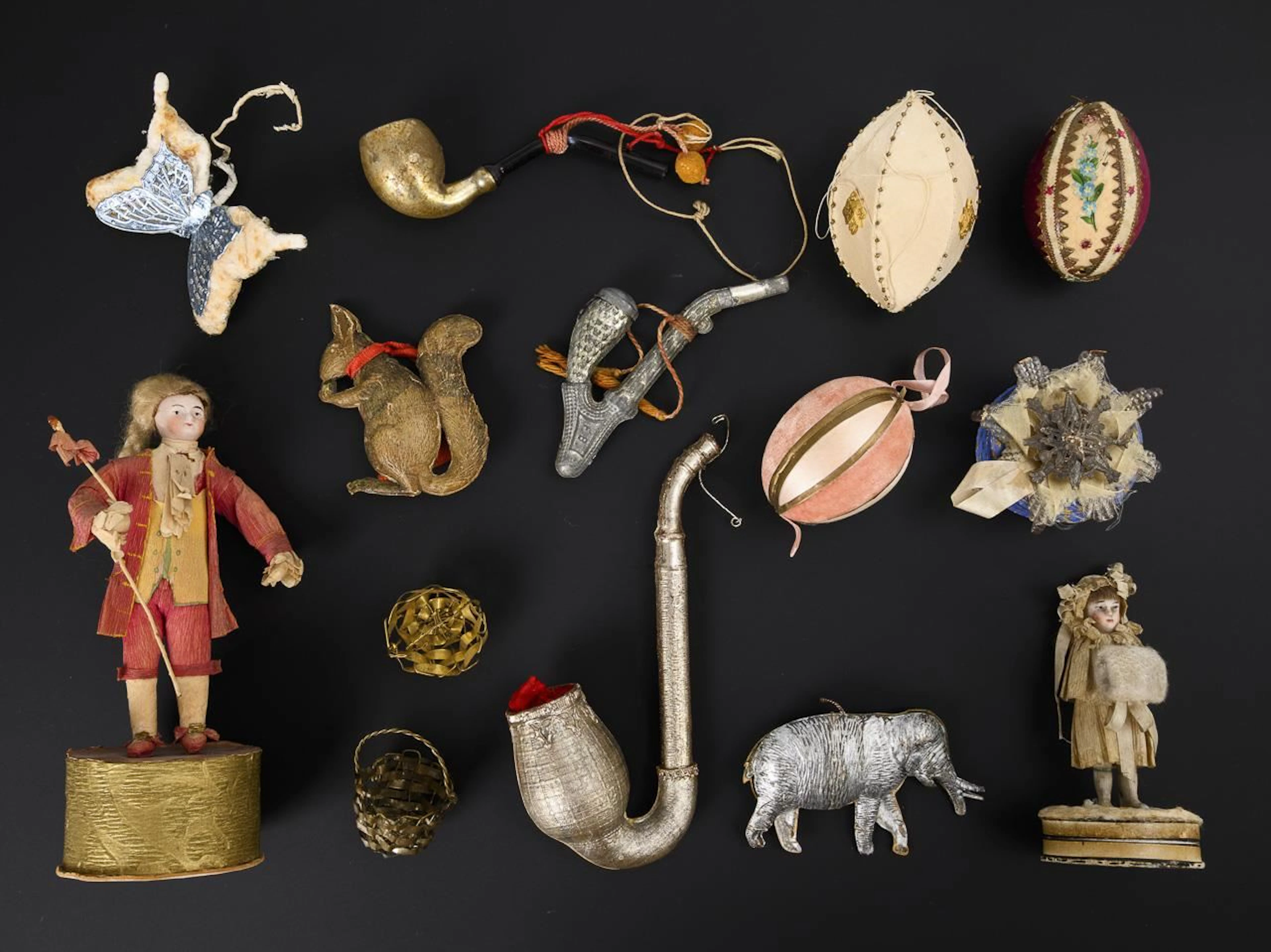 Assortment of 3 candy boxes, Easter eggs, pipes, and animals.