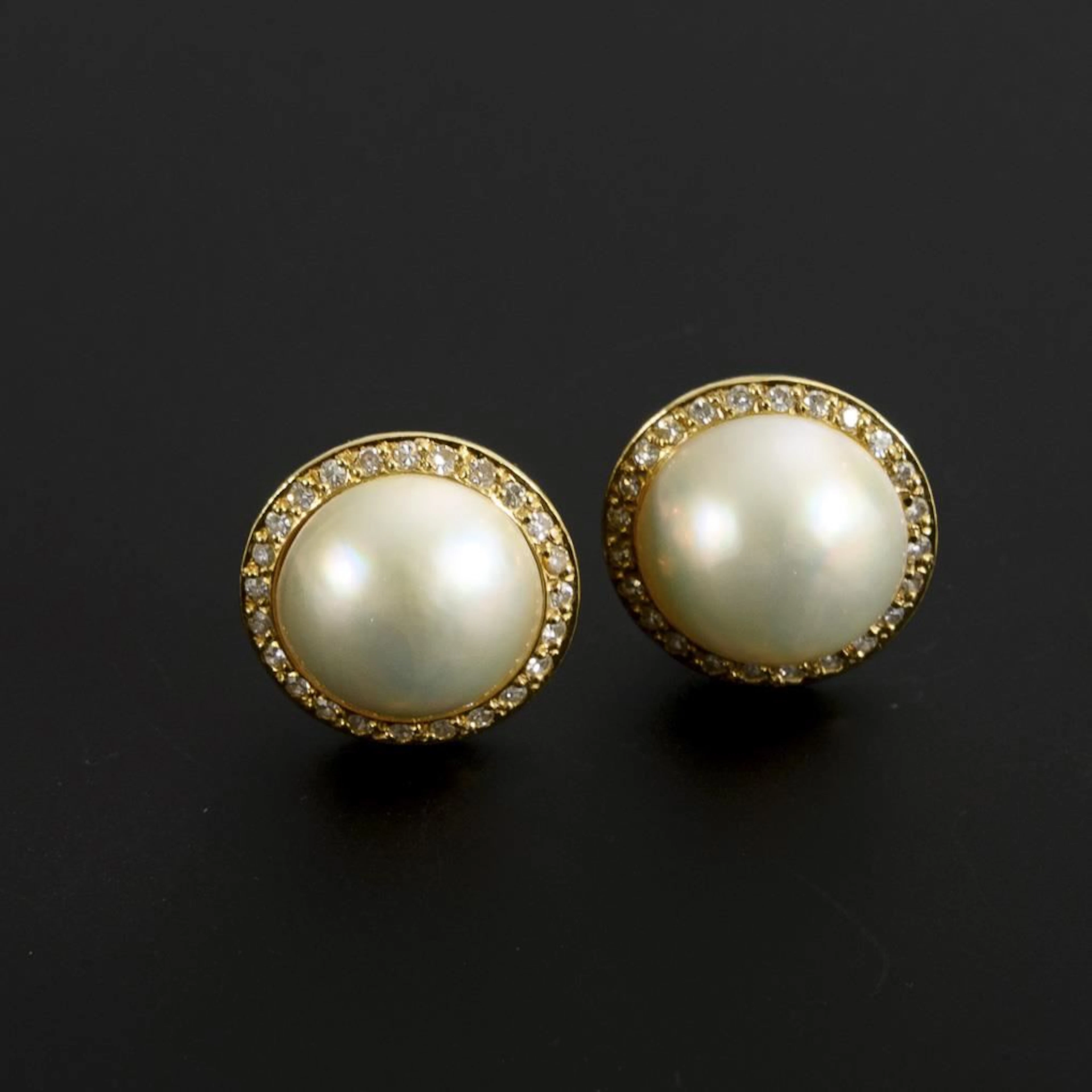 Ear clips with Mabé cultured pearls and diamonds.