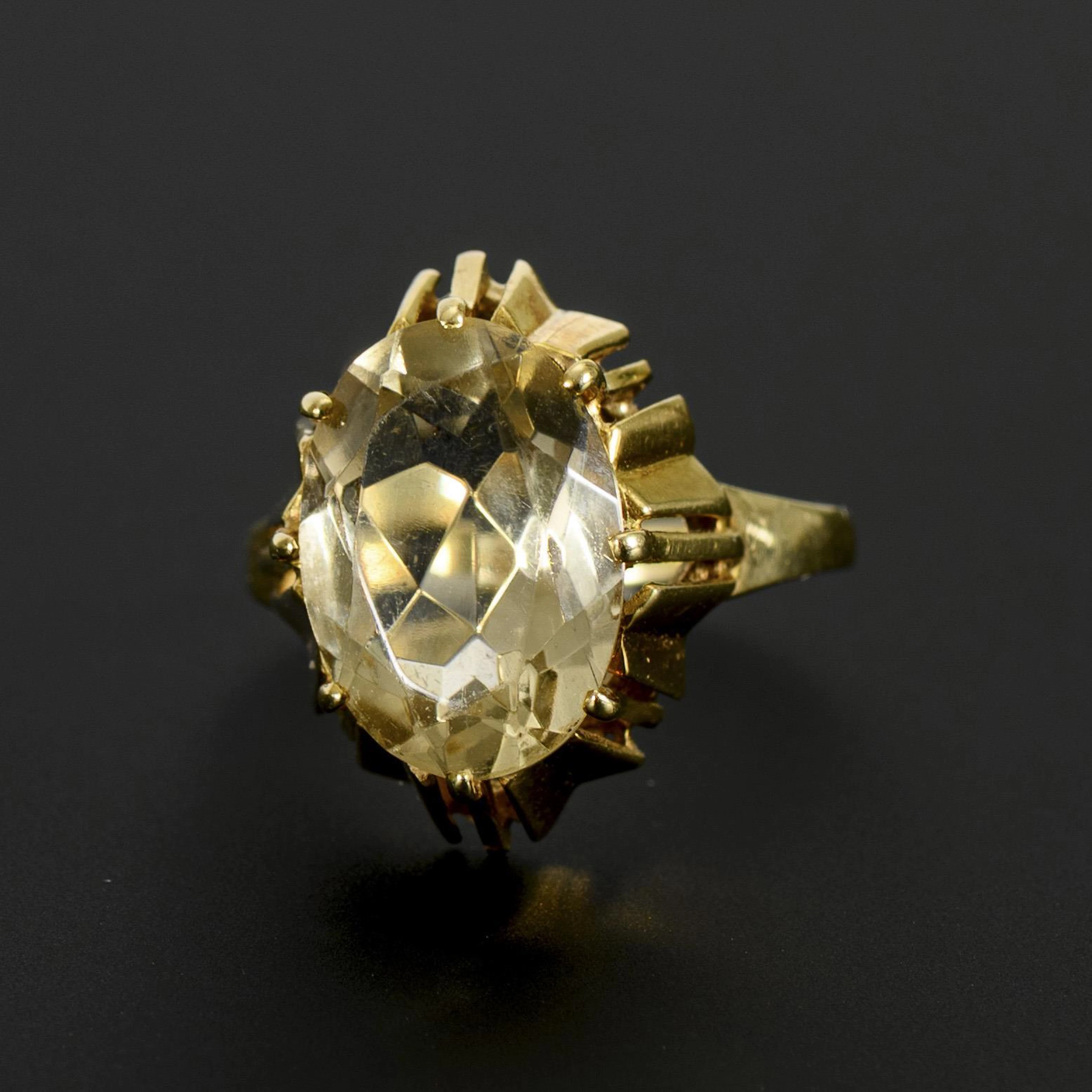 Ring with light colored stone, probably topaz.
