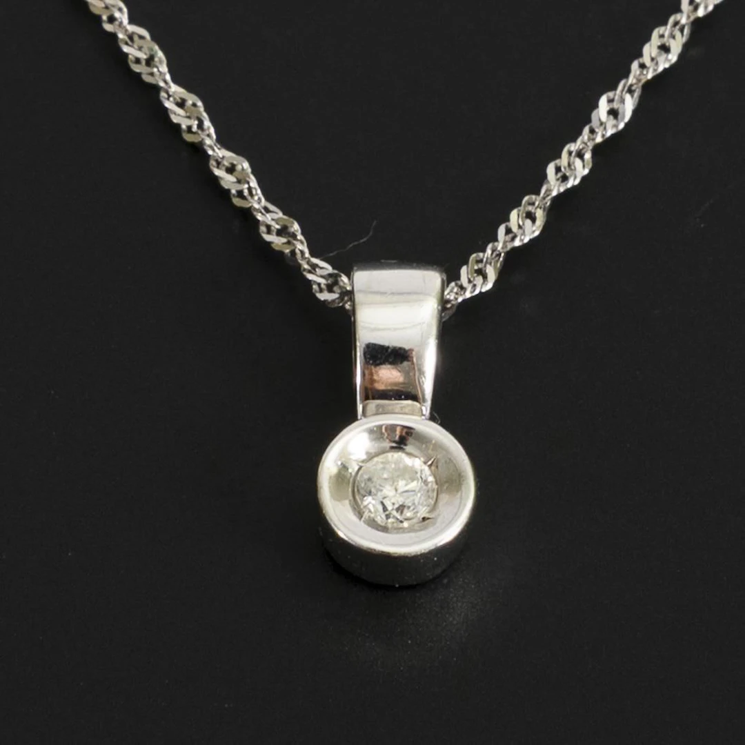 Diamond pendant on a chain.