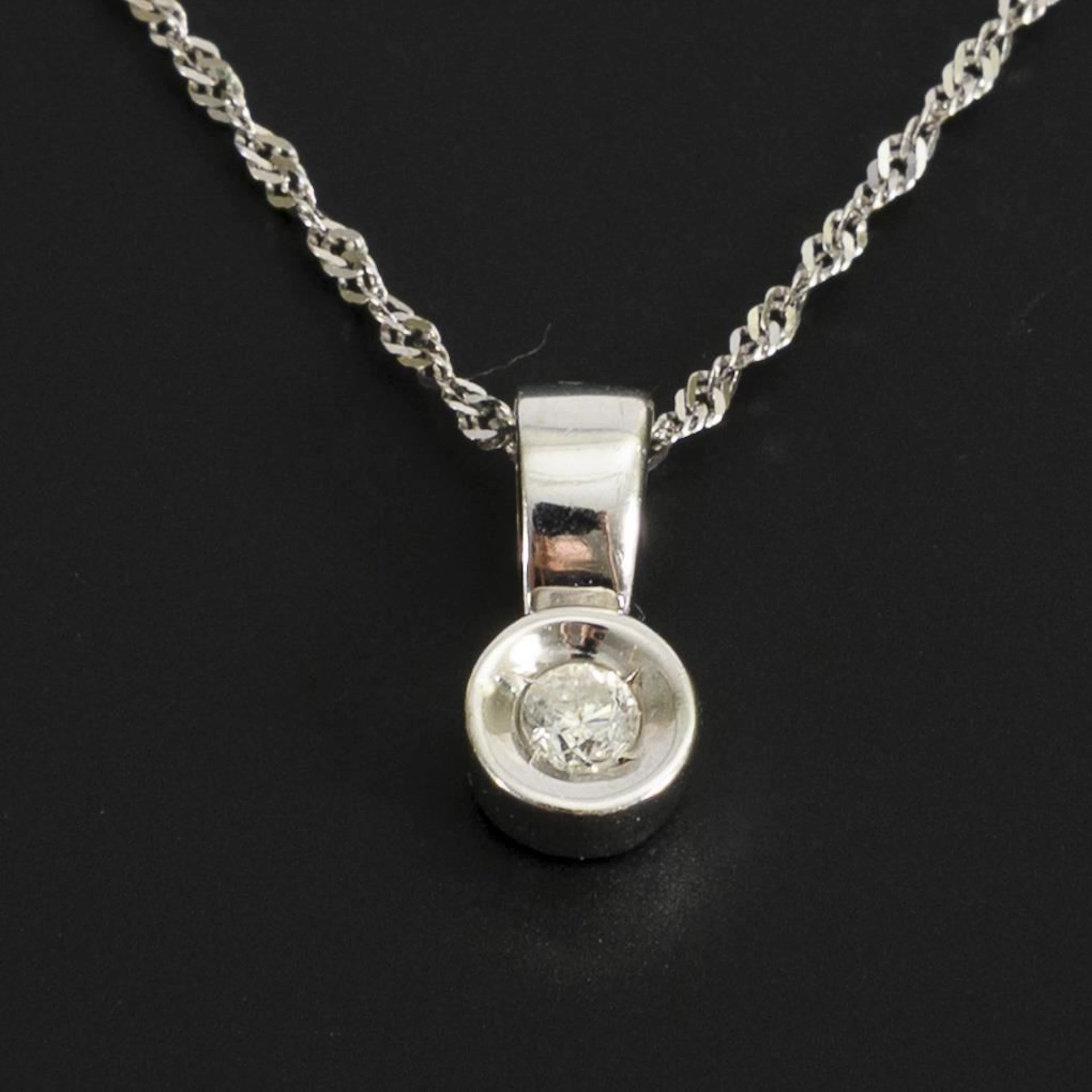 Diamond pendant on a chain.