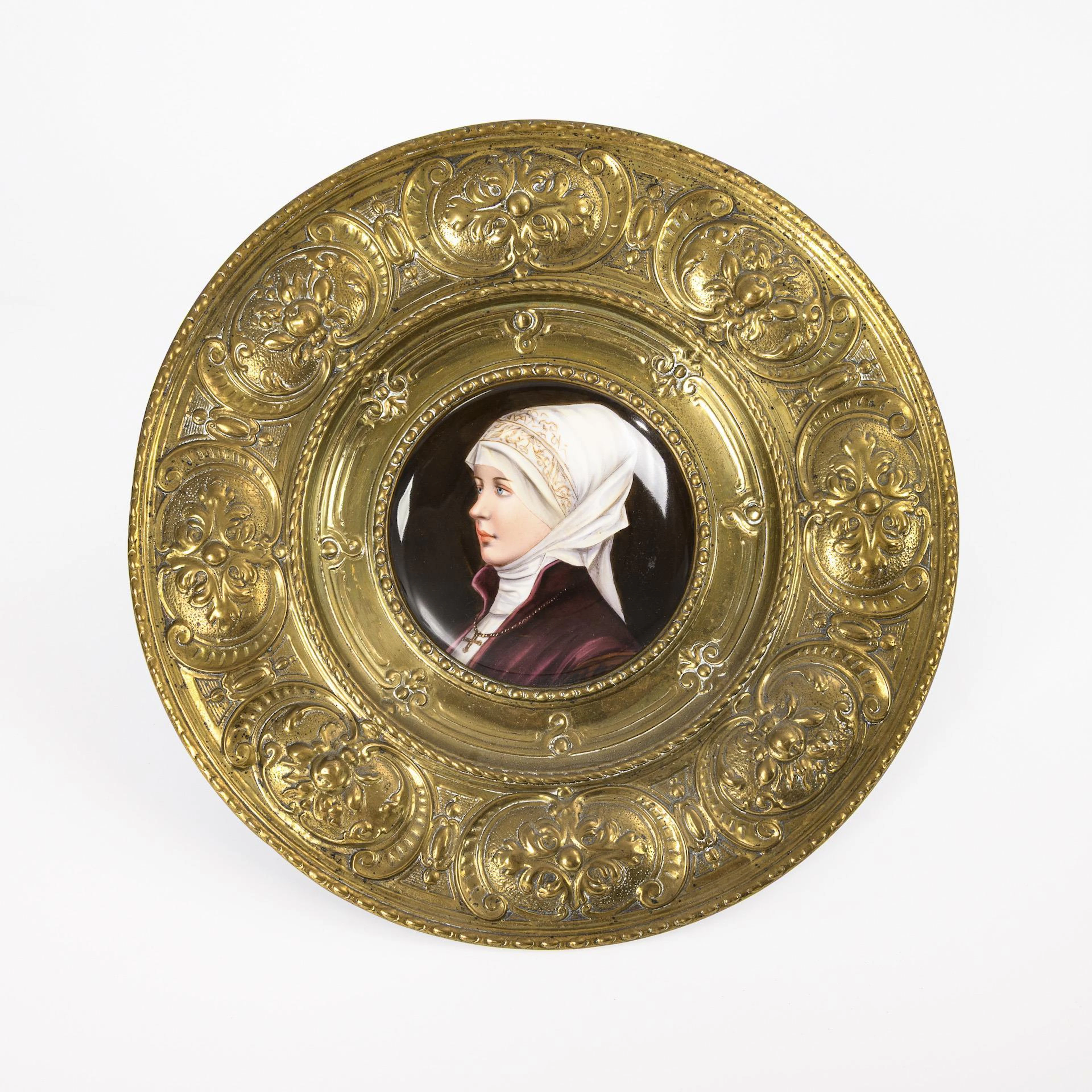 Porcelain painting in brass stippled frame.