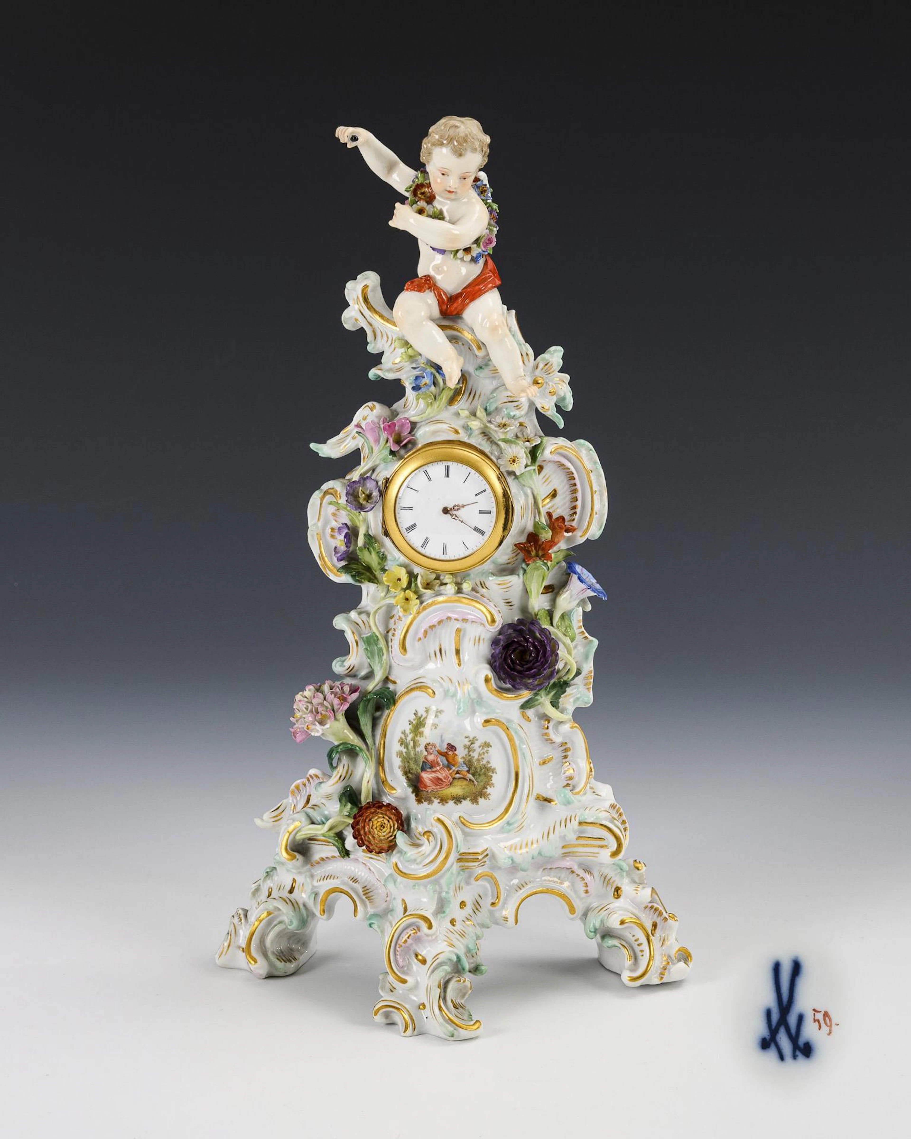 Porcelain clock with putto. Meissen.