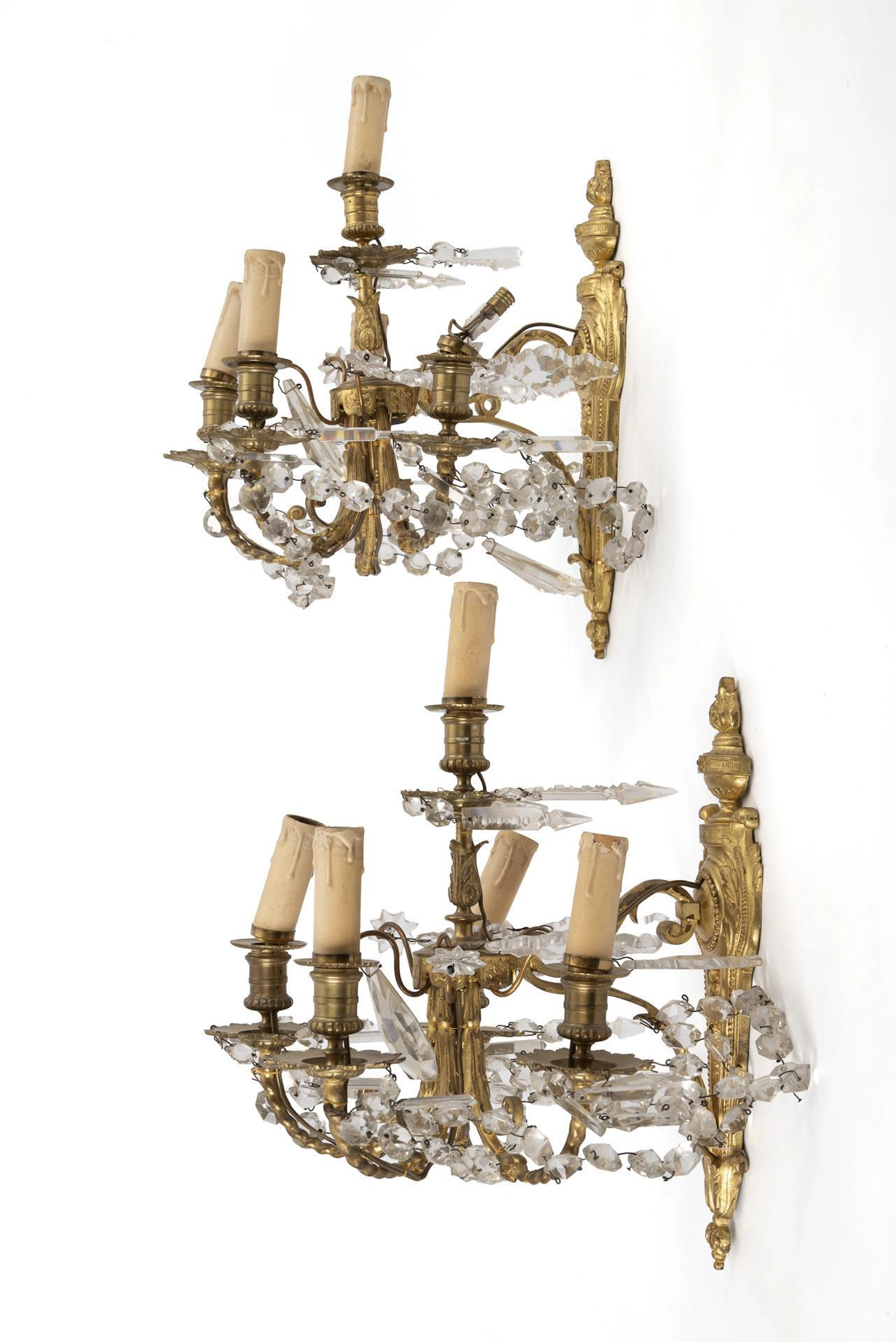 Two five-light sconces.