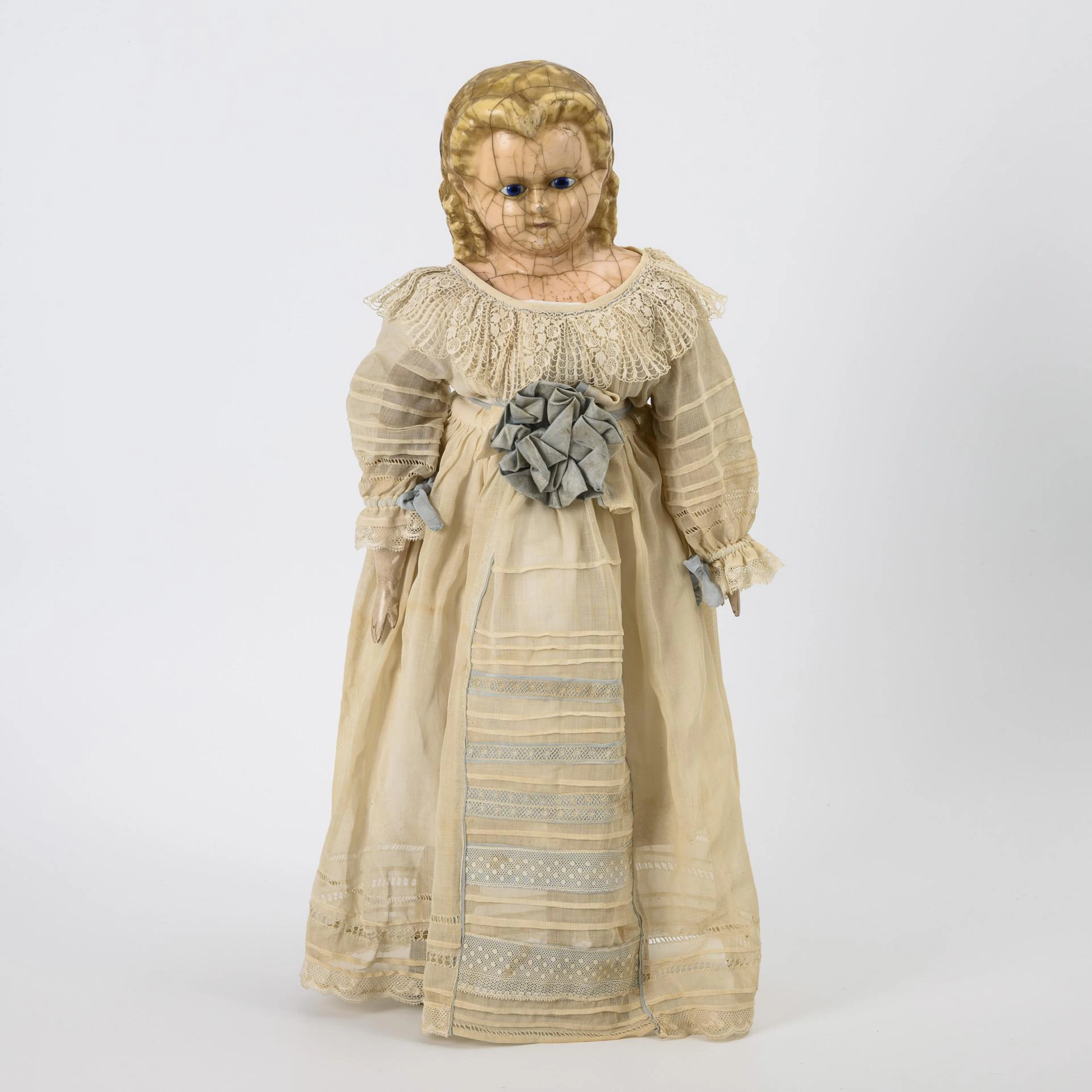 Early doll with waxed papier-mâché breast head.
