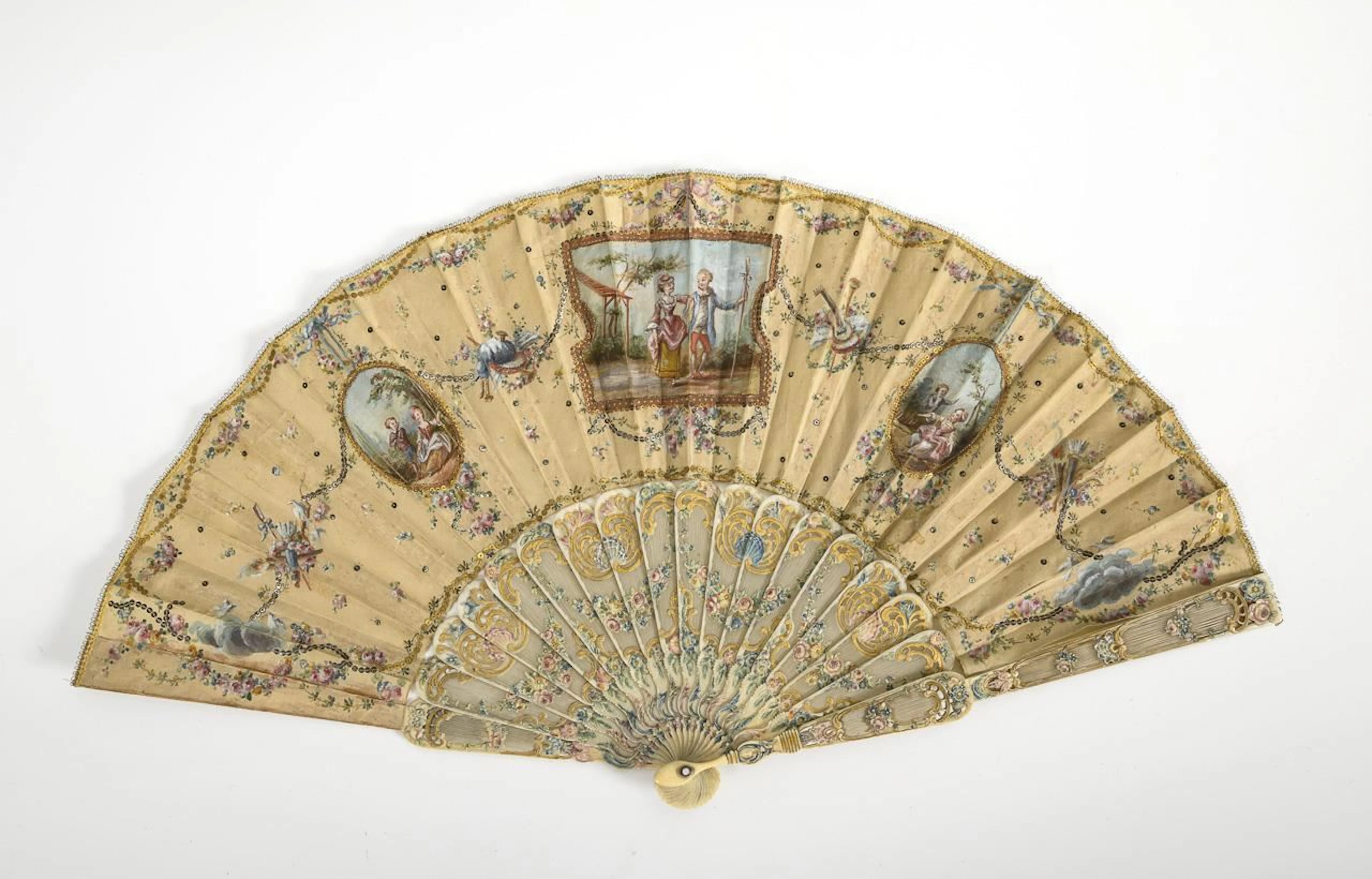 Historic Rococo fan featuring pastoral scenes.