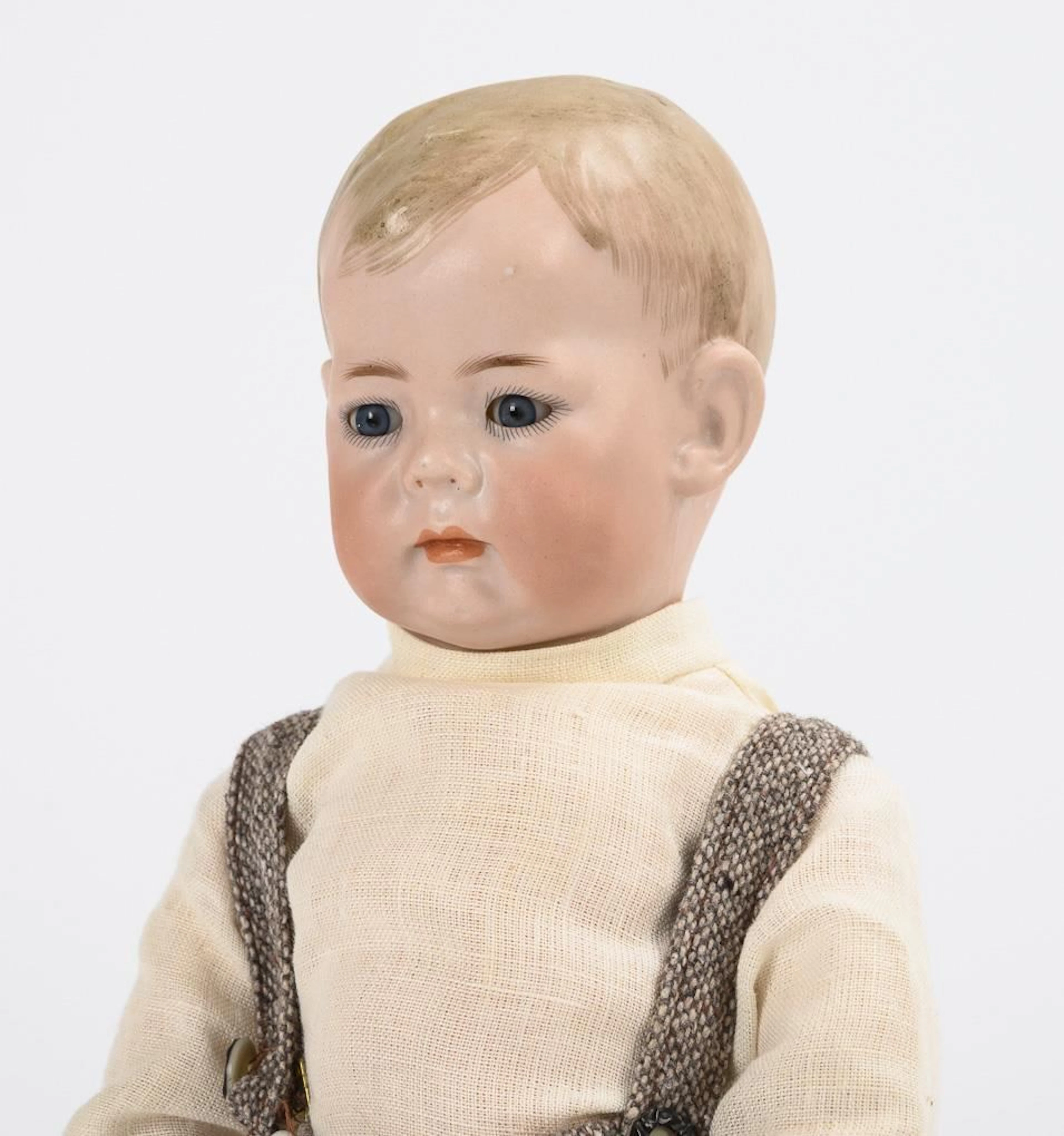 Full-head character figure with a toddler's body. Kämmer & Reinhardt.