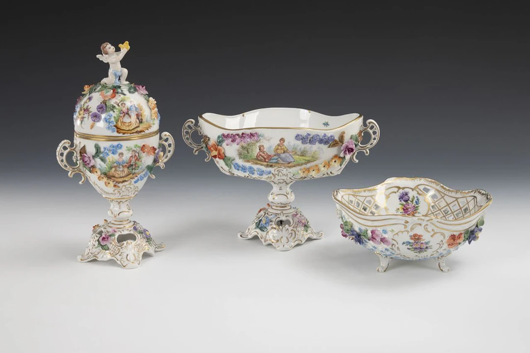 Box, foot dish, and openwork dish with floral decoration. Potschappel.