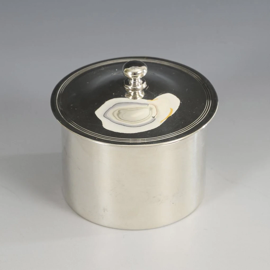 Small silver cylindrical box from the 18th century. John Scofield, London.