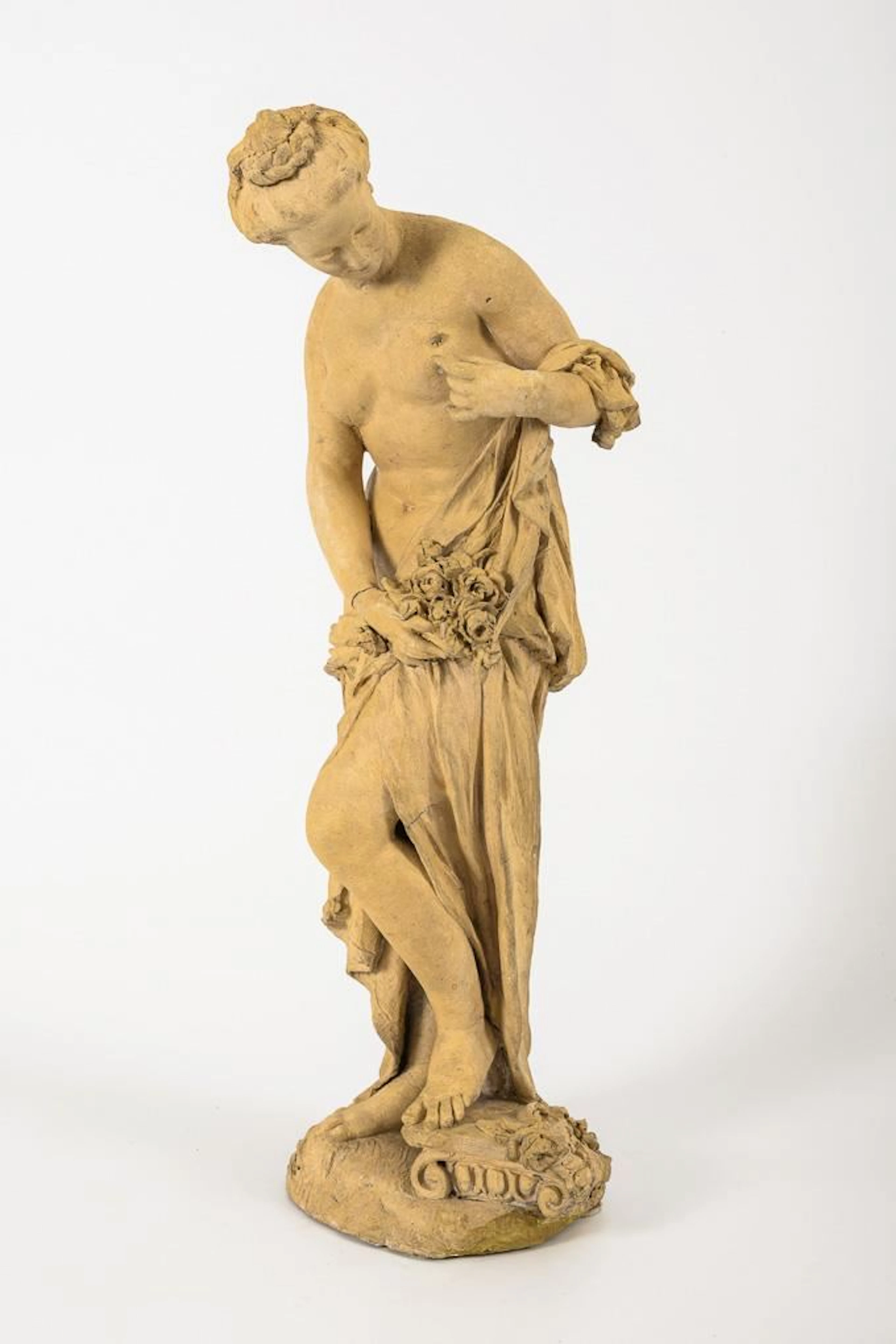 Antique-style female figure with an insect on her chest