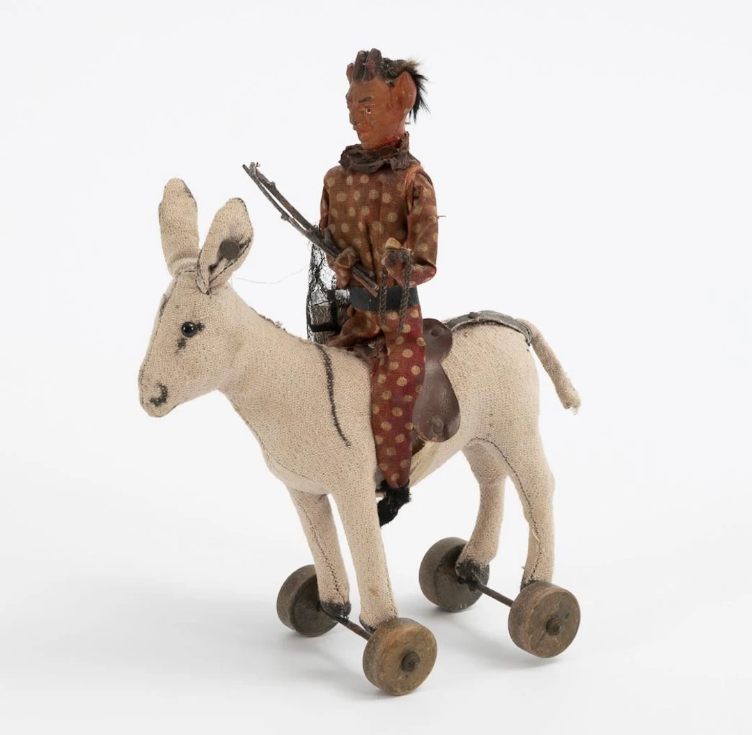 Krampus on a Steiff donkey.