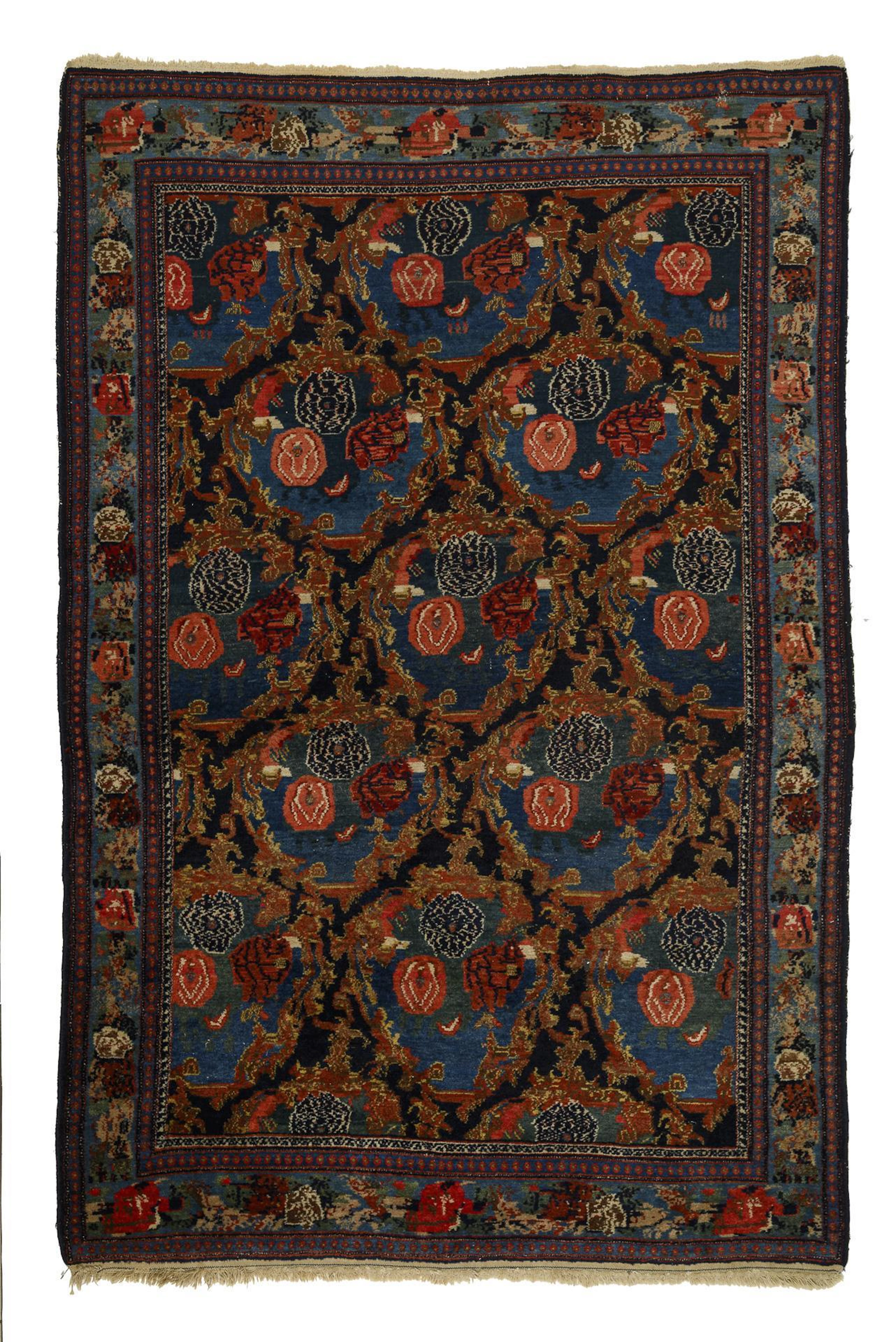"Senneh" knotted rug with Gol Farang design.