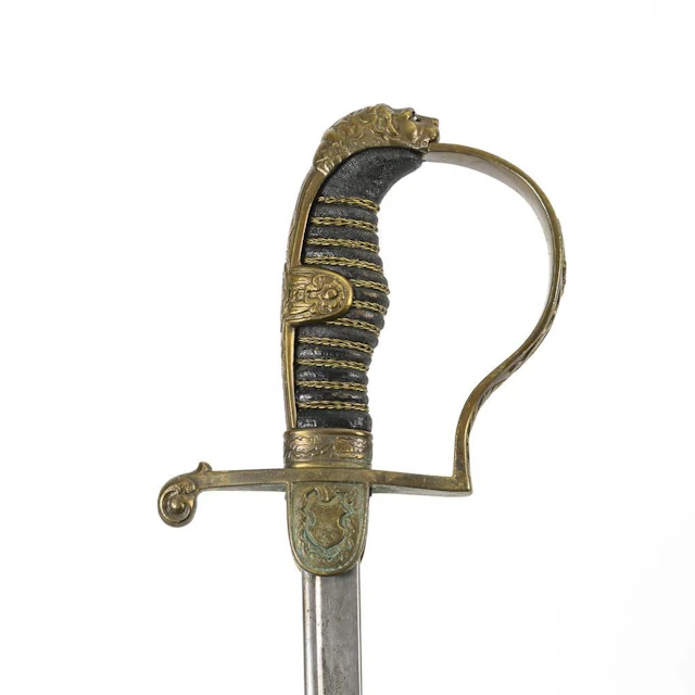 Lion's-head saber with scabbard.