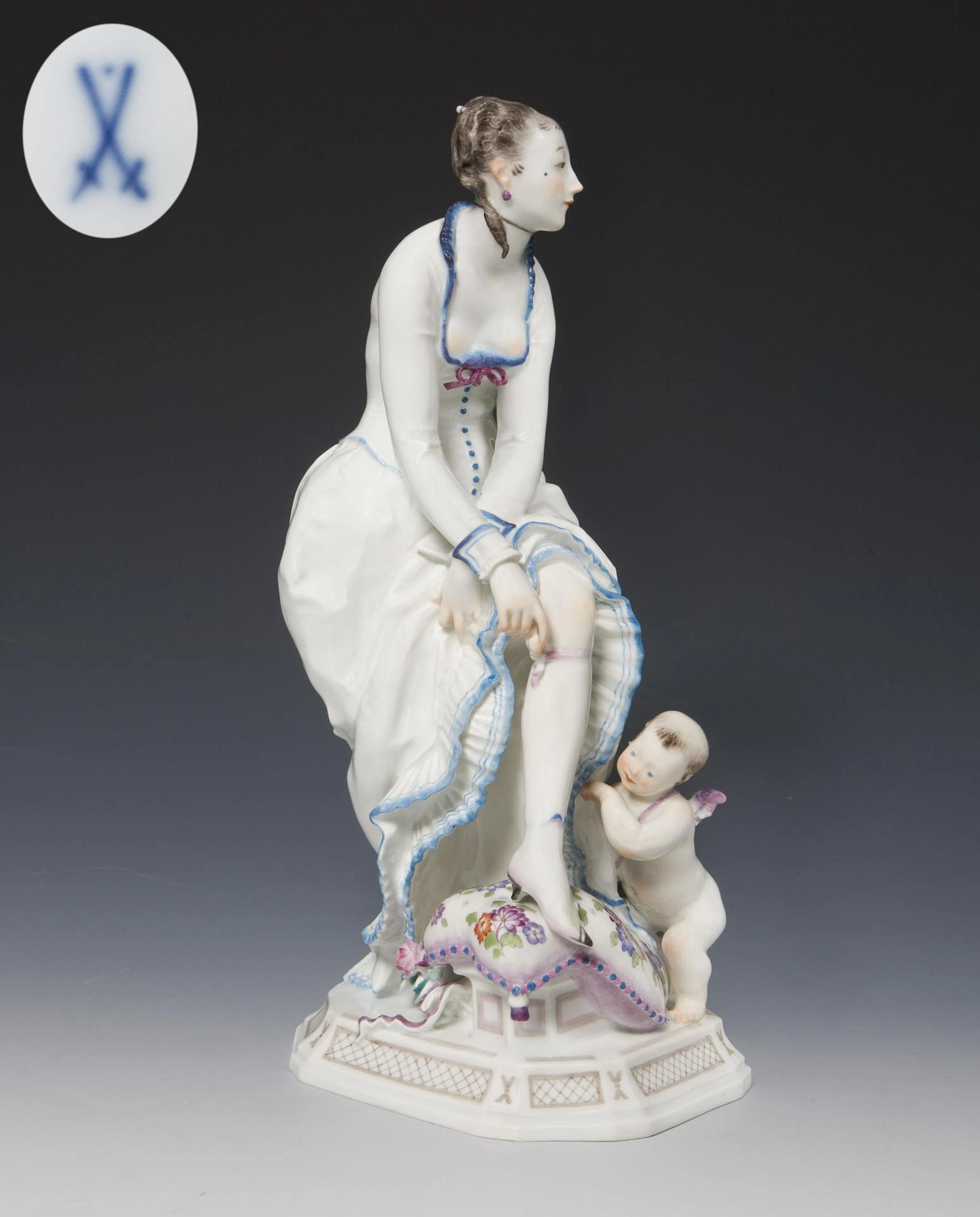 Art deco figurine: Lady with garter and cupid. Meissen.