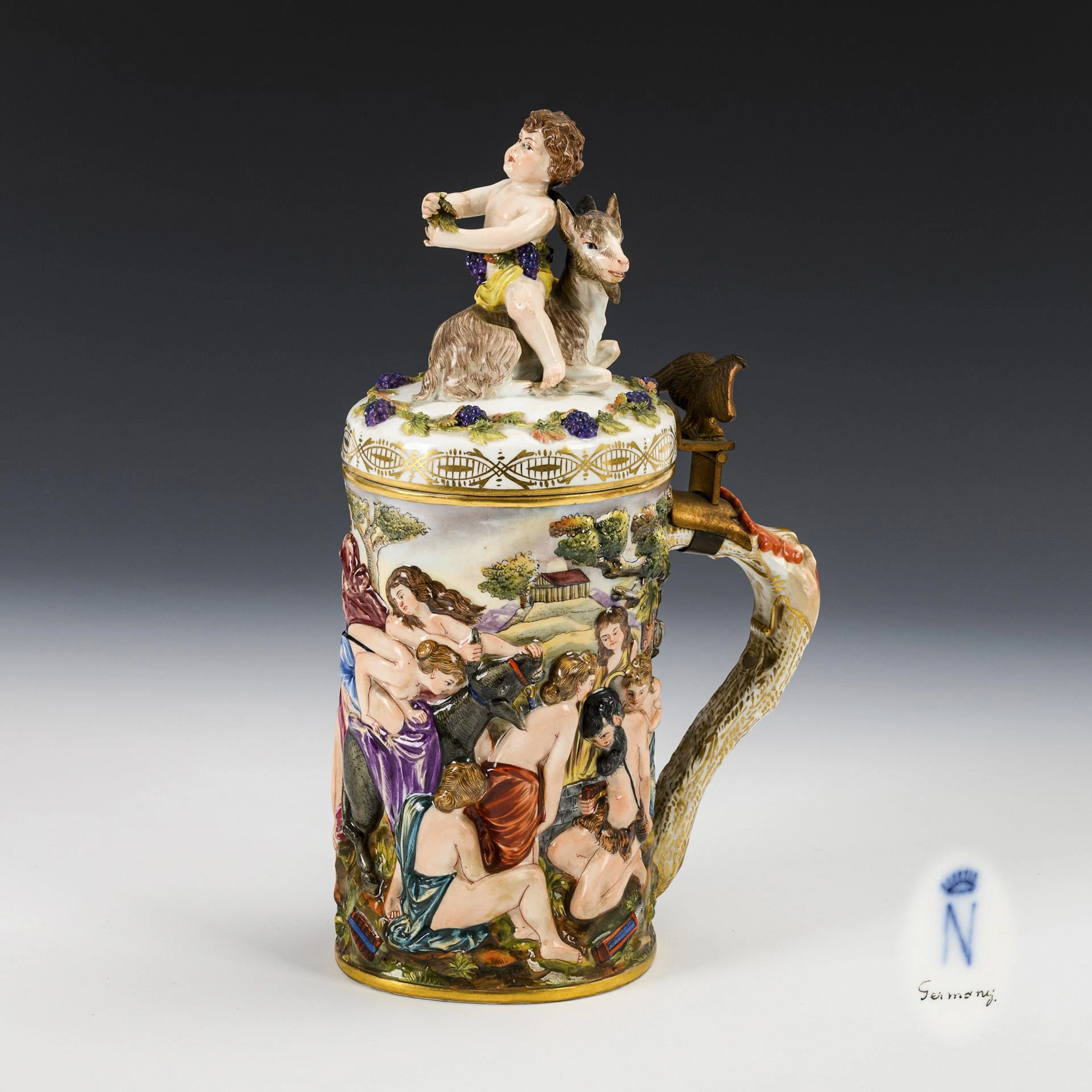 Beer mug with capodimonte decoration.