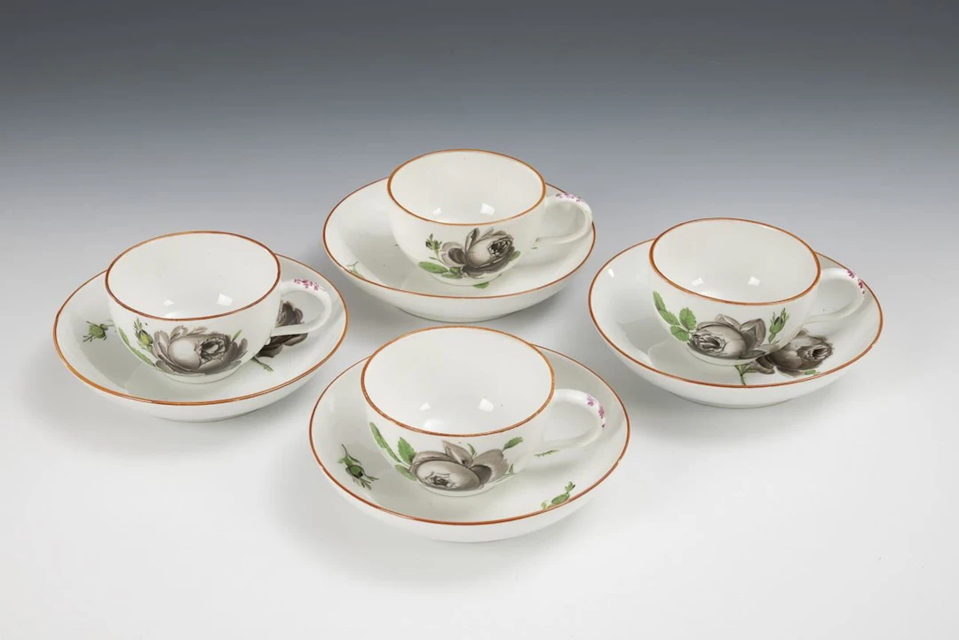 4 Baroque cups with rose designs. Meissen.