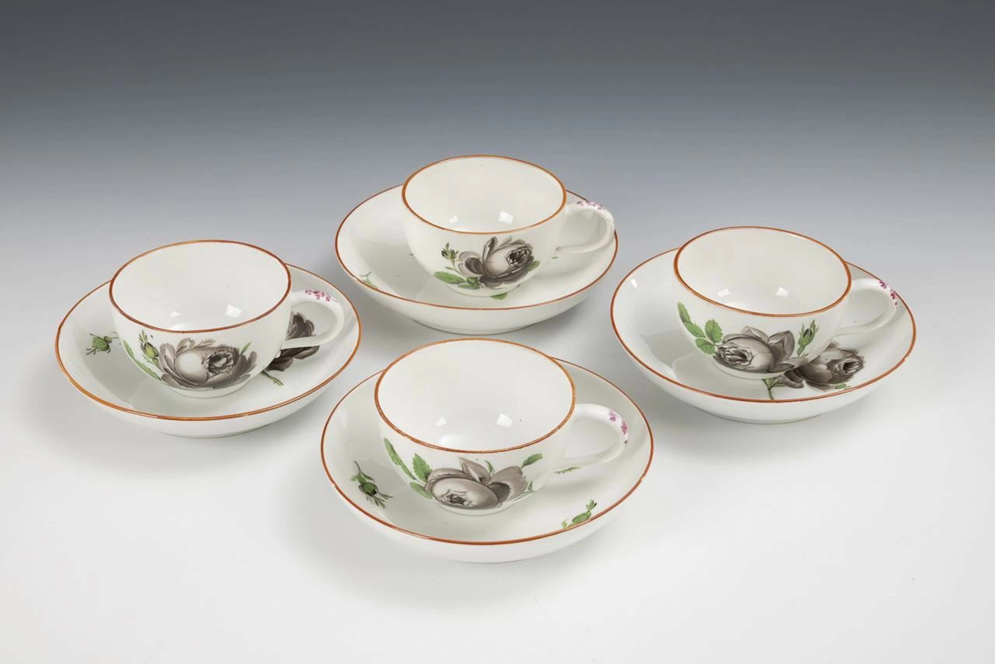 4 Baroque cups with rose designs. Meissen.