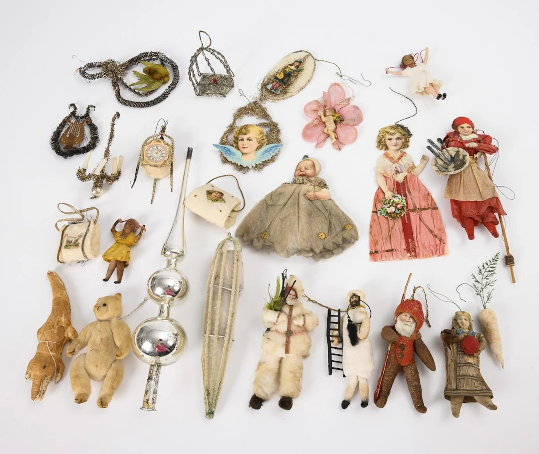 Assortment of Christmas tree ornaments with a silver tree topper.