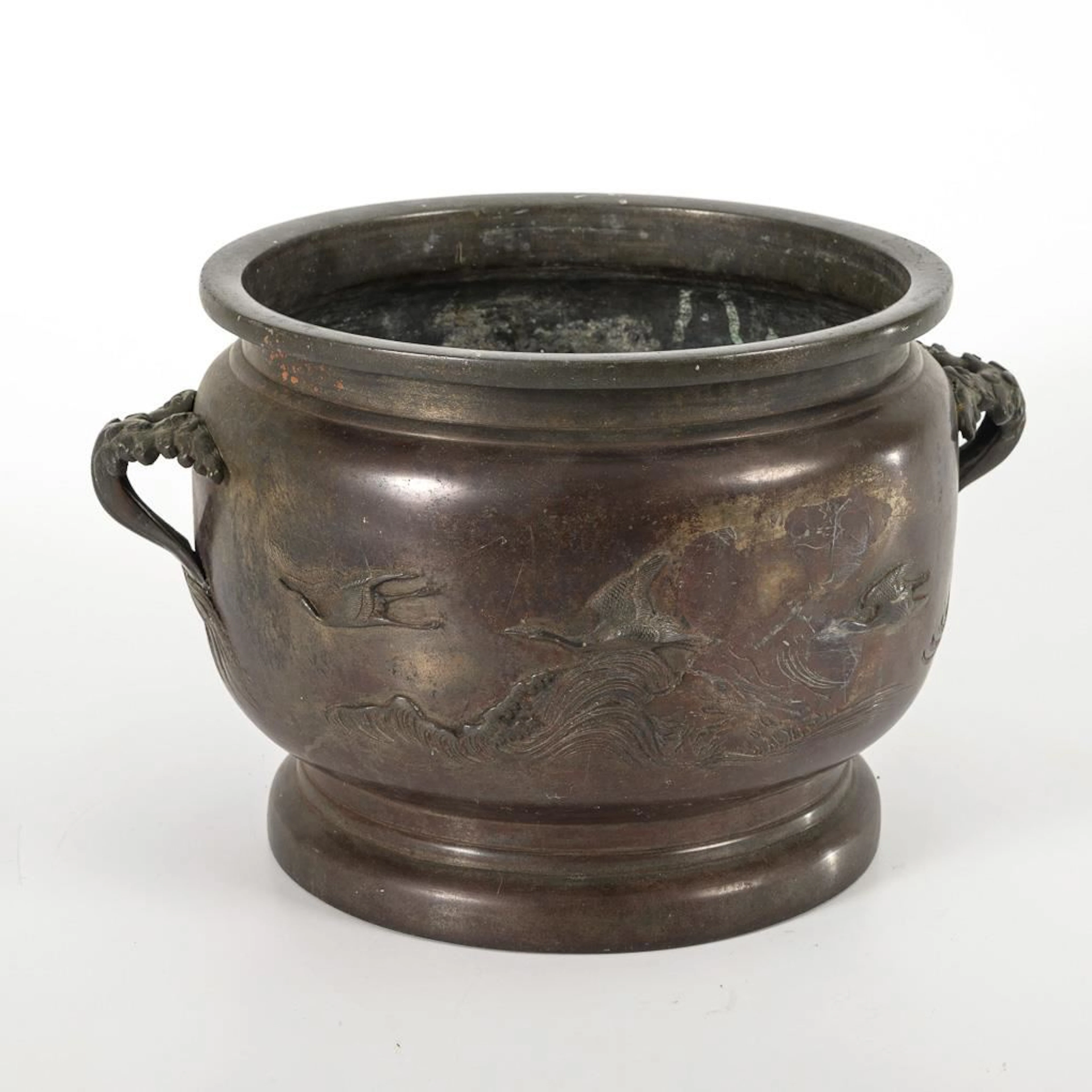 A bronze vessel with beautiful relief work.