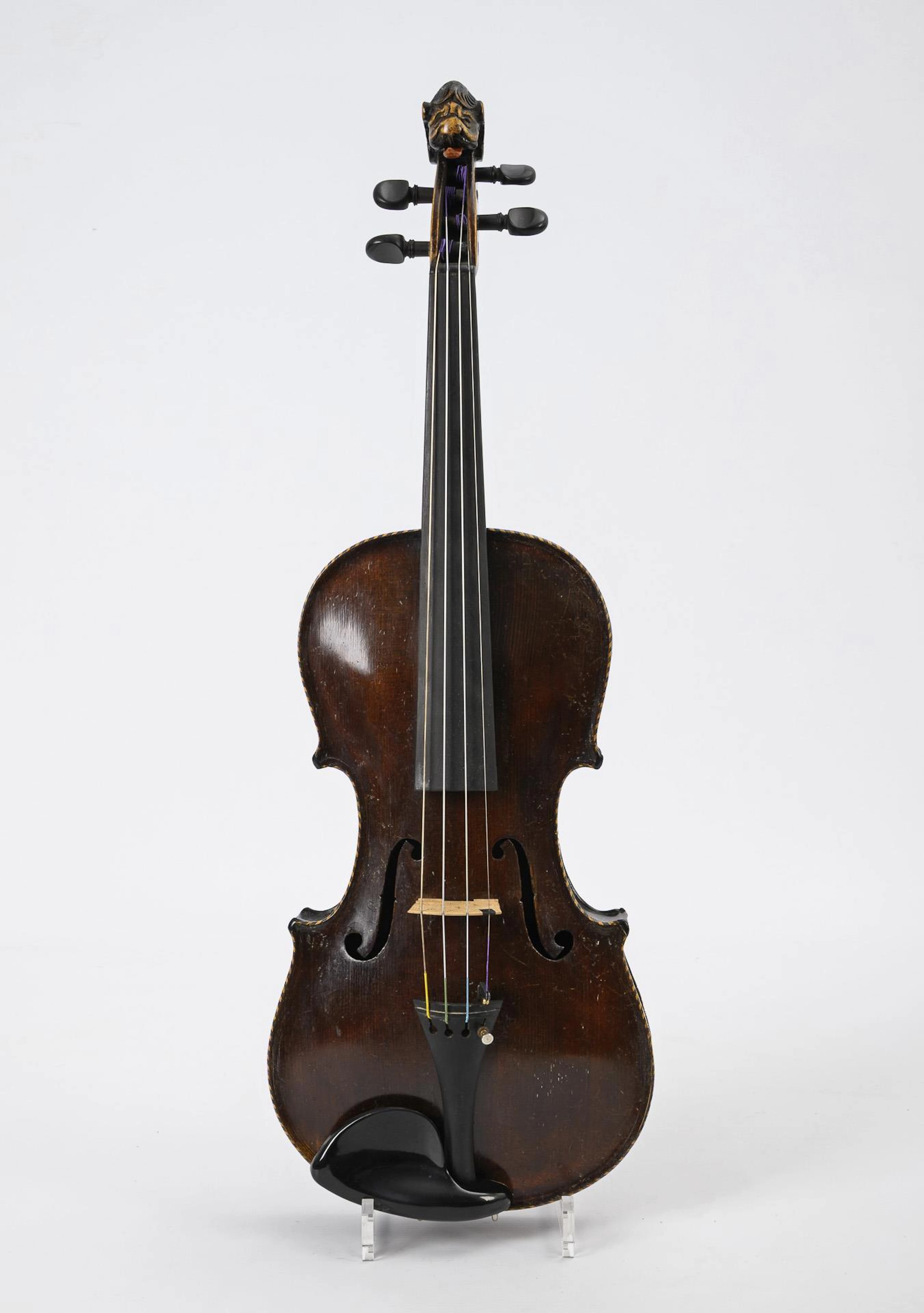 Violin with lion's head.