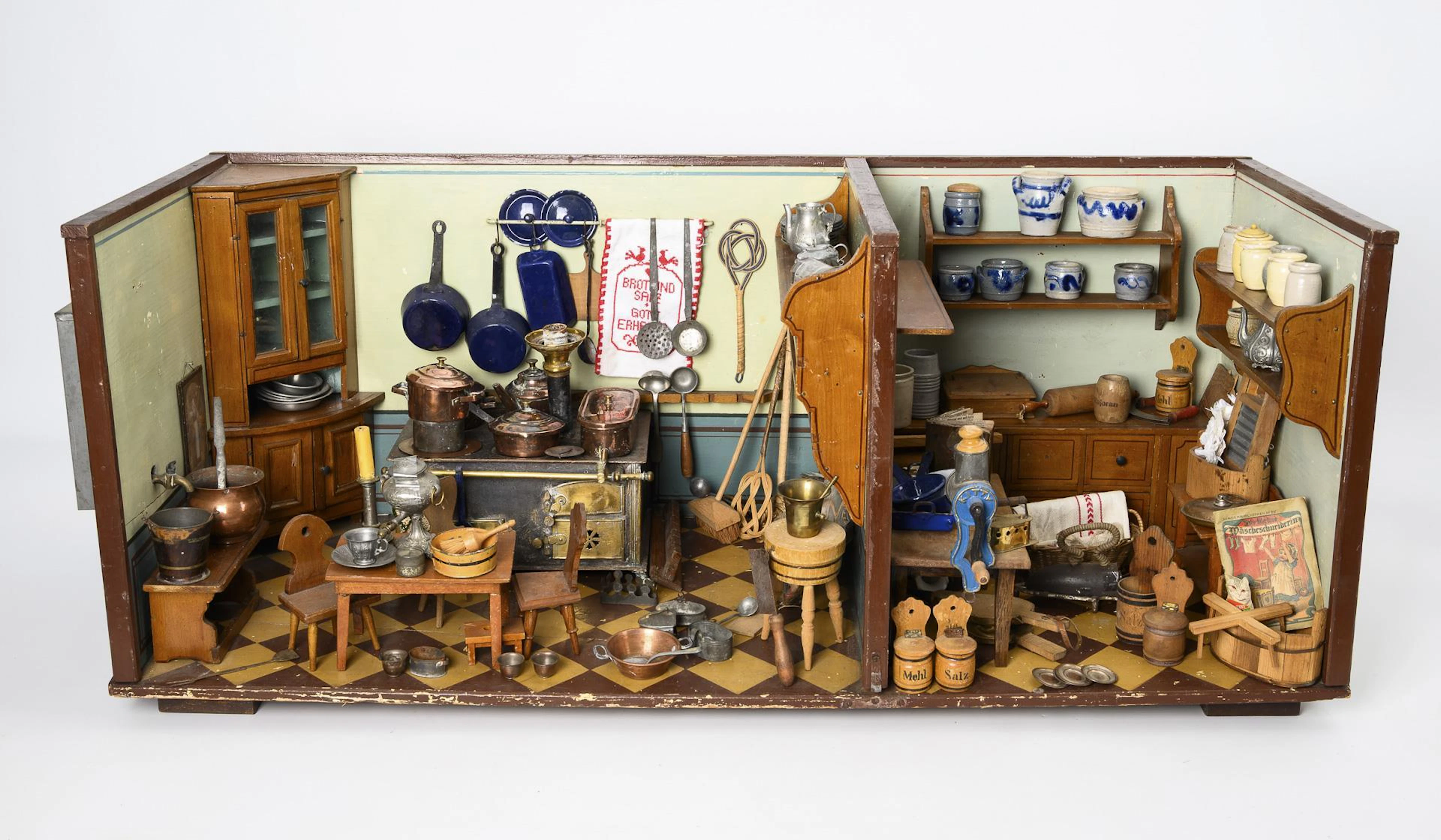 Richly furnished doll's kitchen.