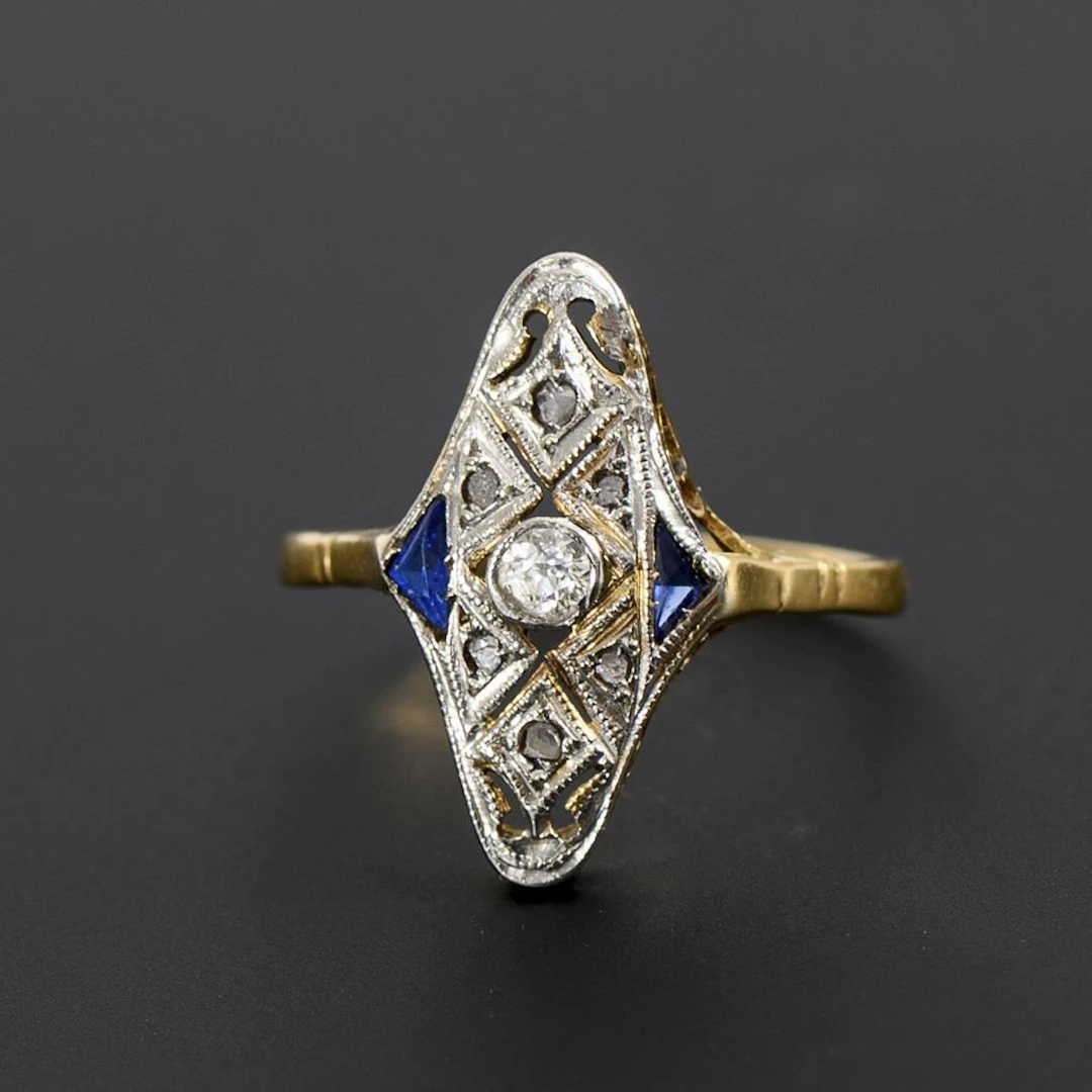 Art Deco navette ring with an old-cut diamond and blue gemstones or