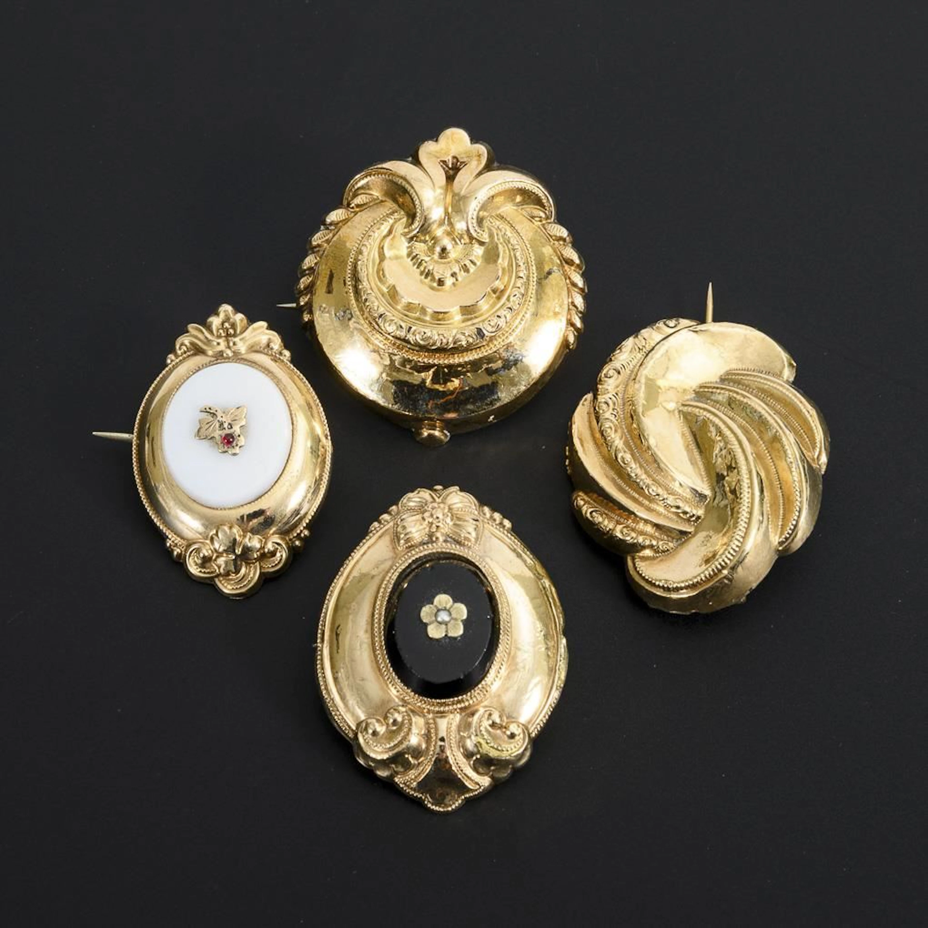 Set of 4 Rolled Gold Brooches.