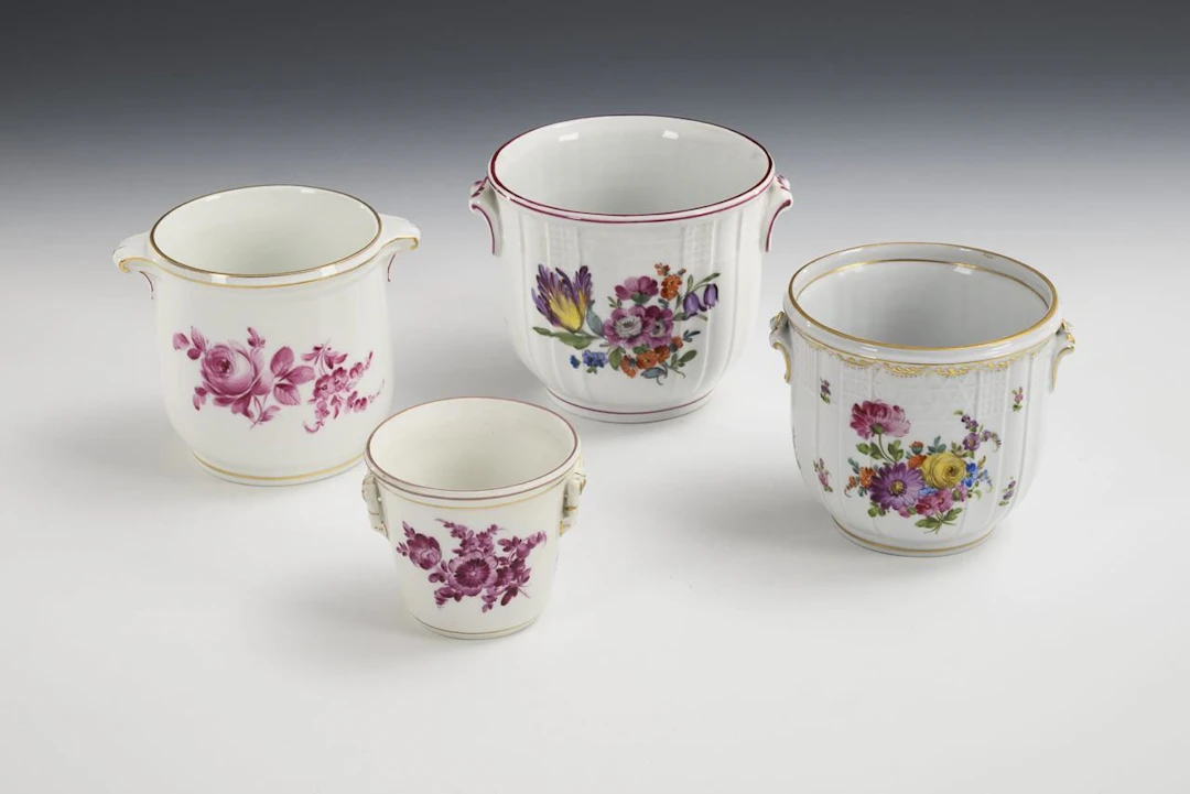 4 cachepots with floral designs. Potschappel.