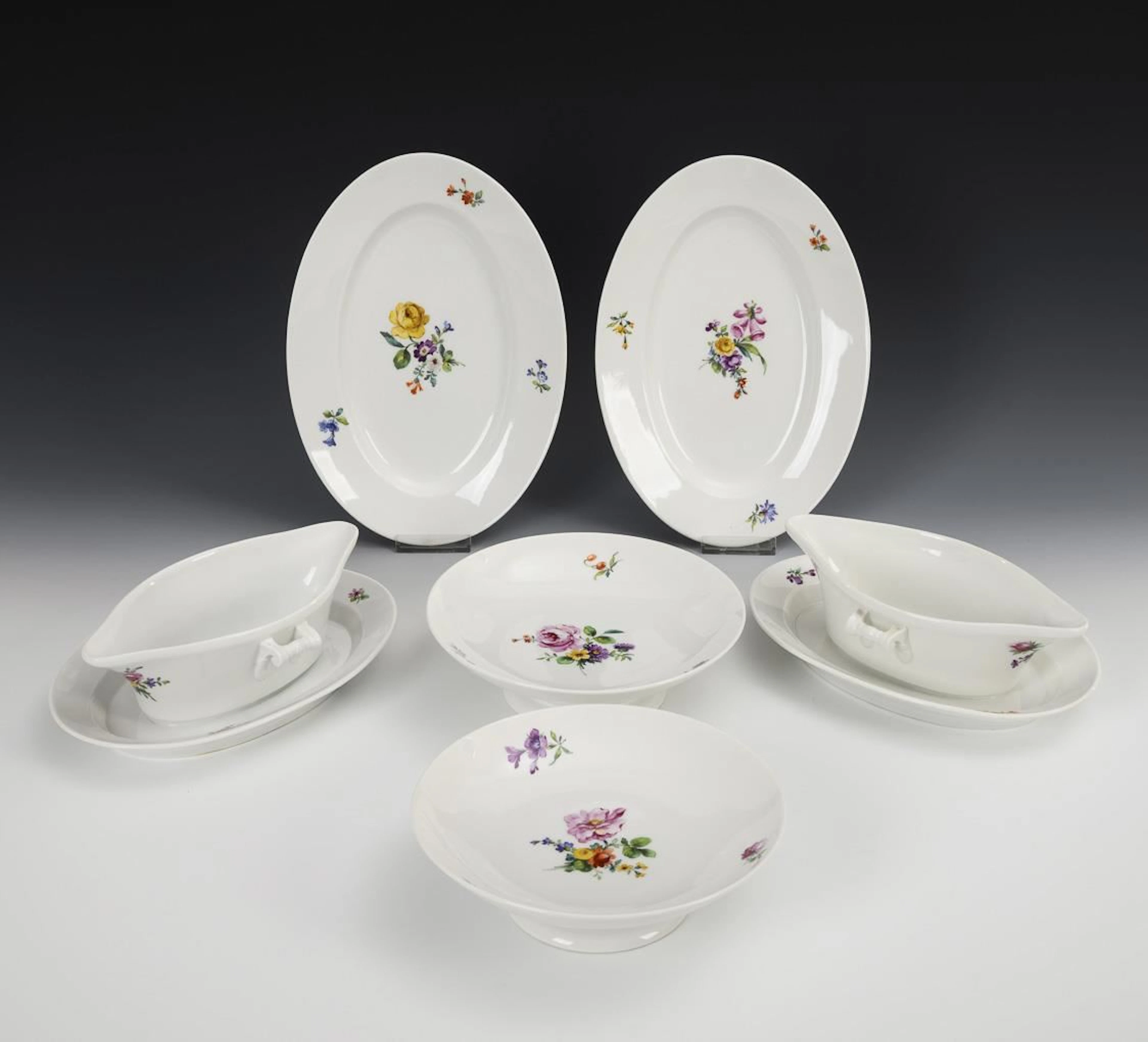 6 pieces of a dinner service with floral designs. KPM Berlin.