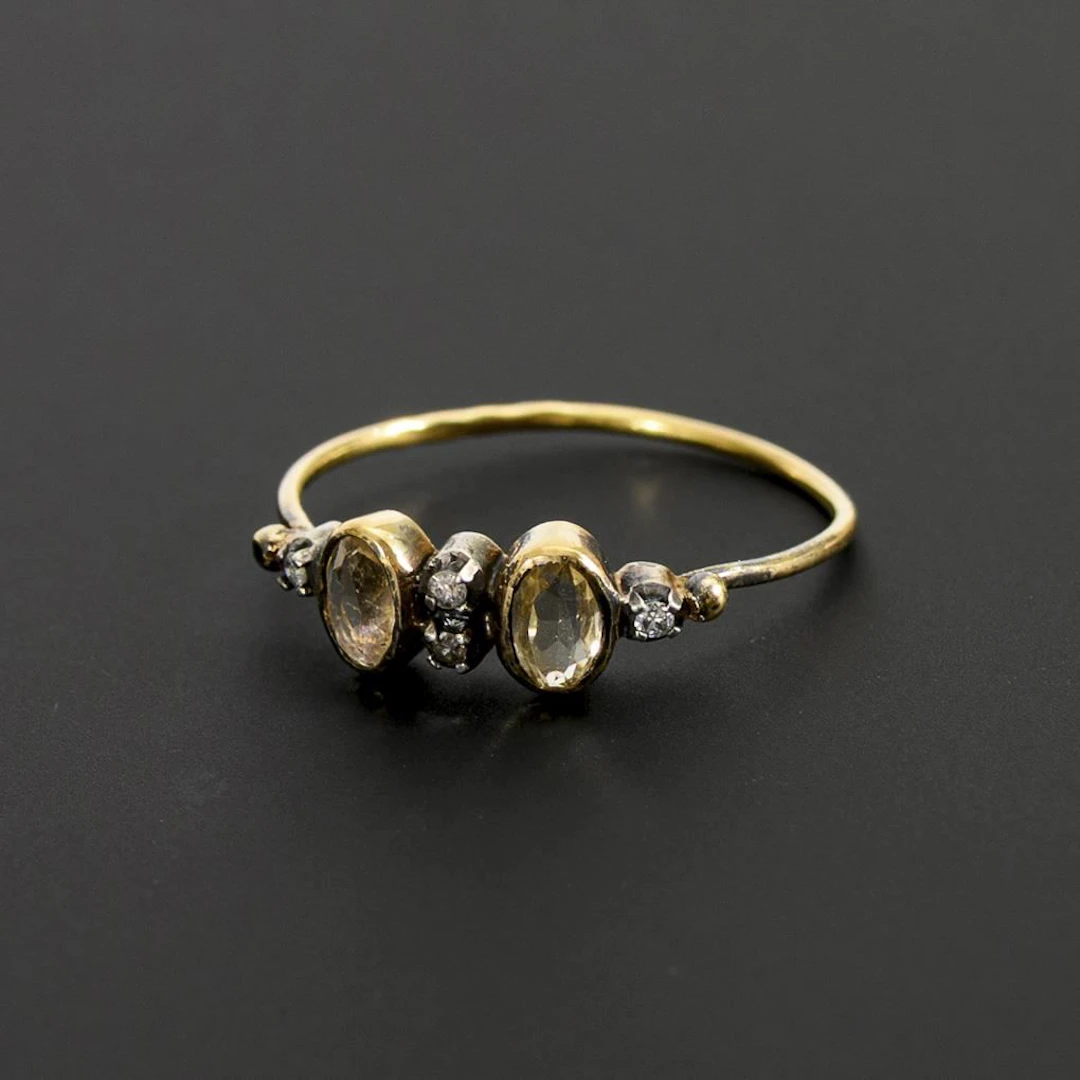 Ring with colored gemstones and small diamonds.