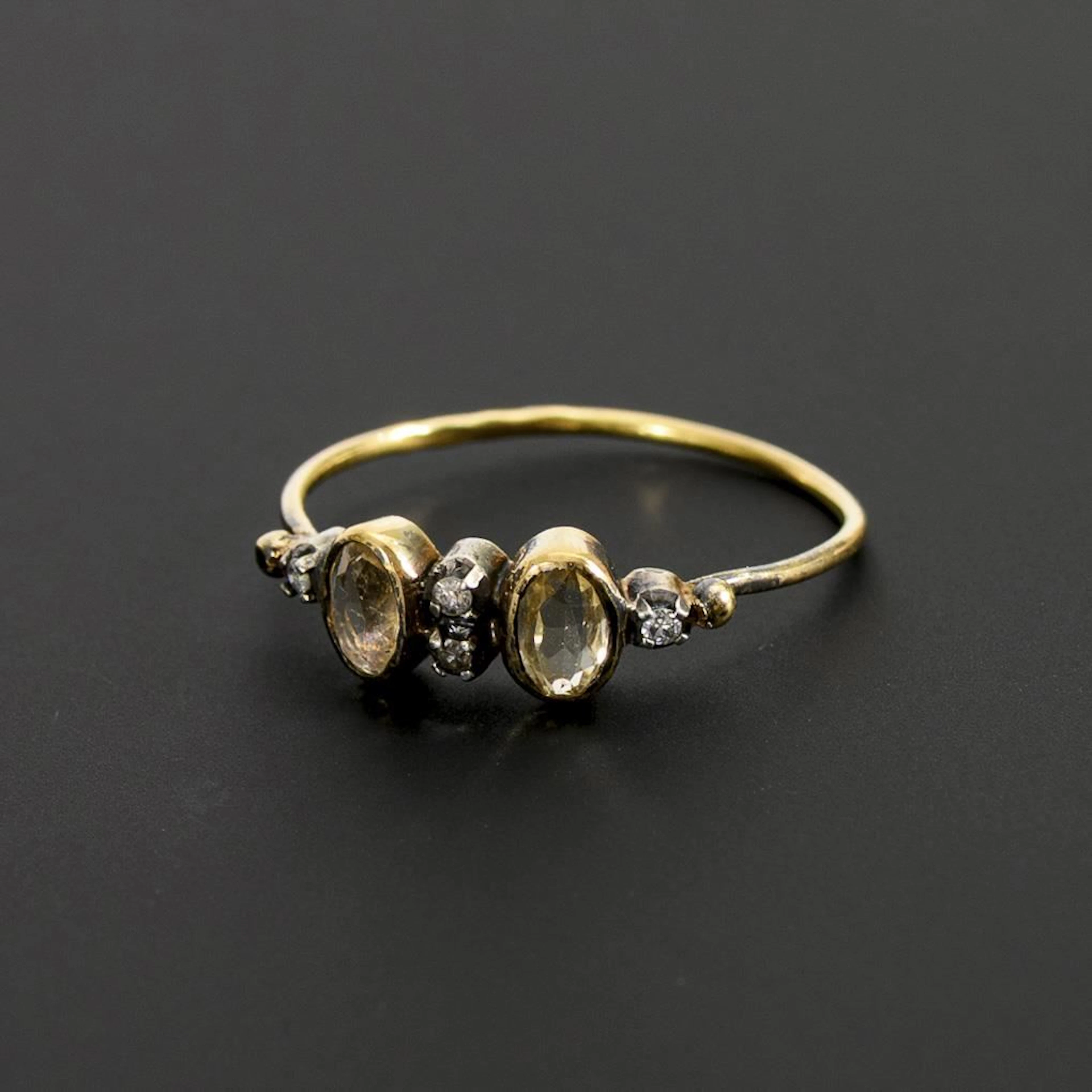 Ring with colored gemstones and small diamonds.