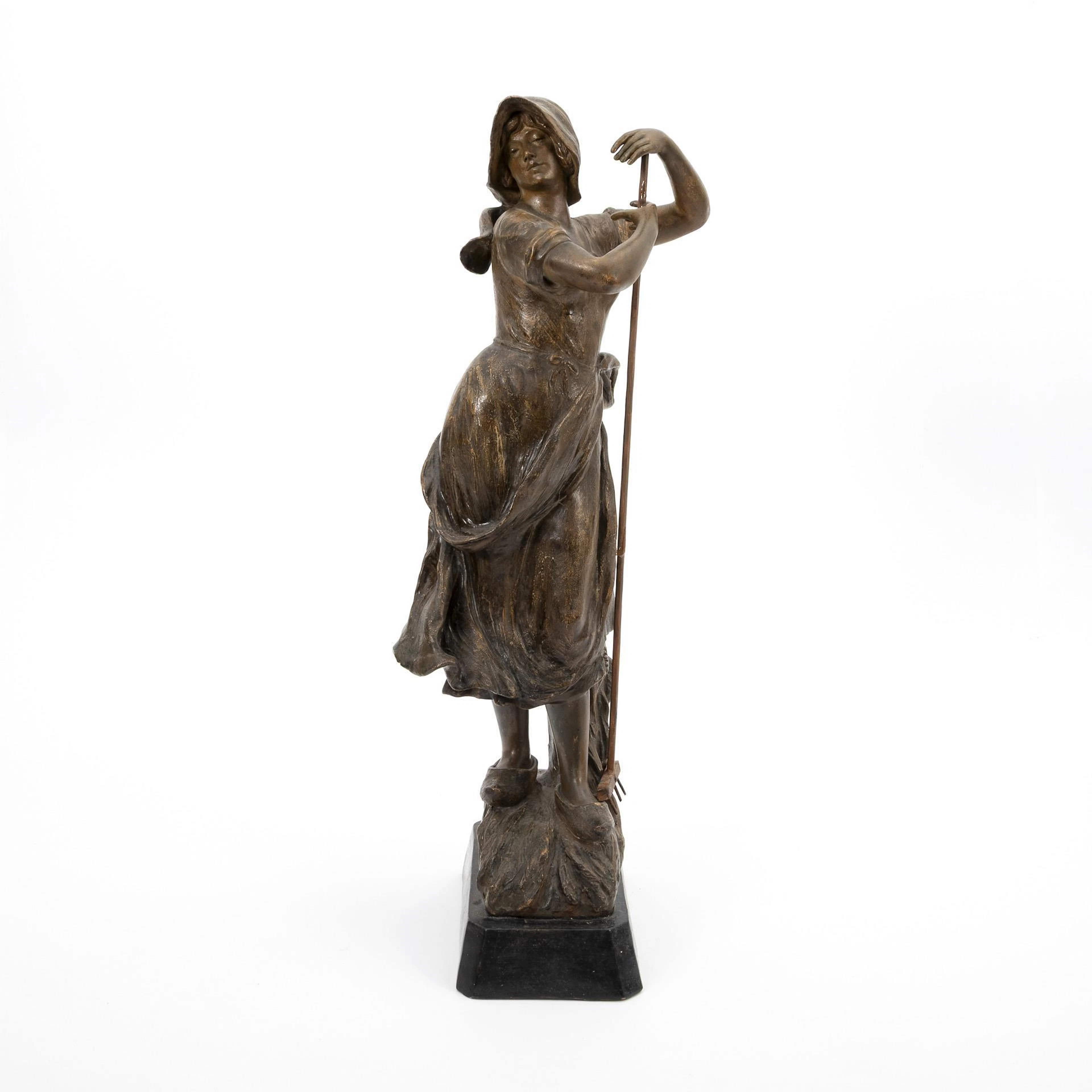 Art Nouveau terracotta figurine "Dutch girl with rake". Viennese manufactory