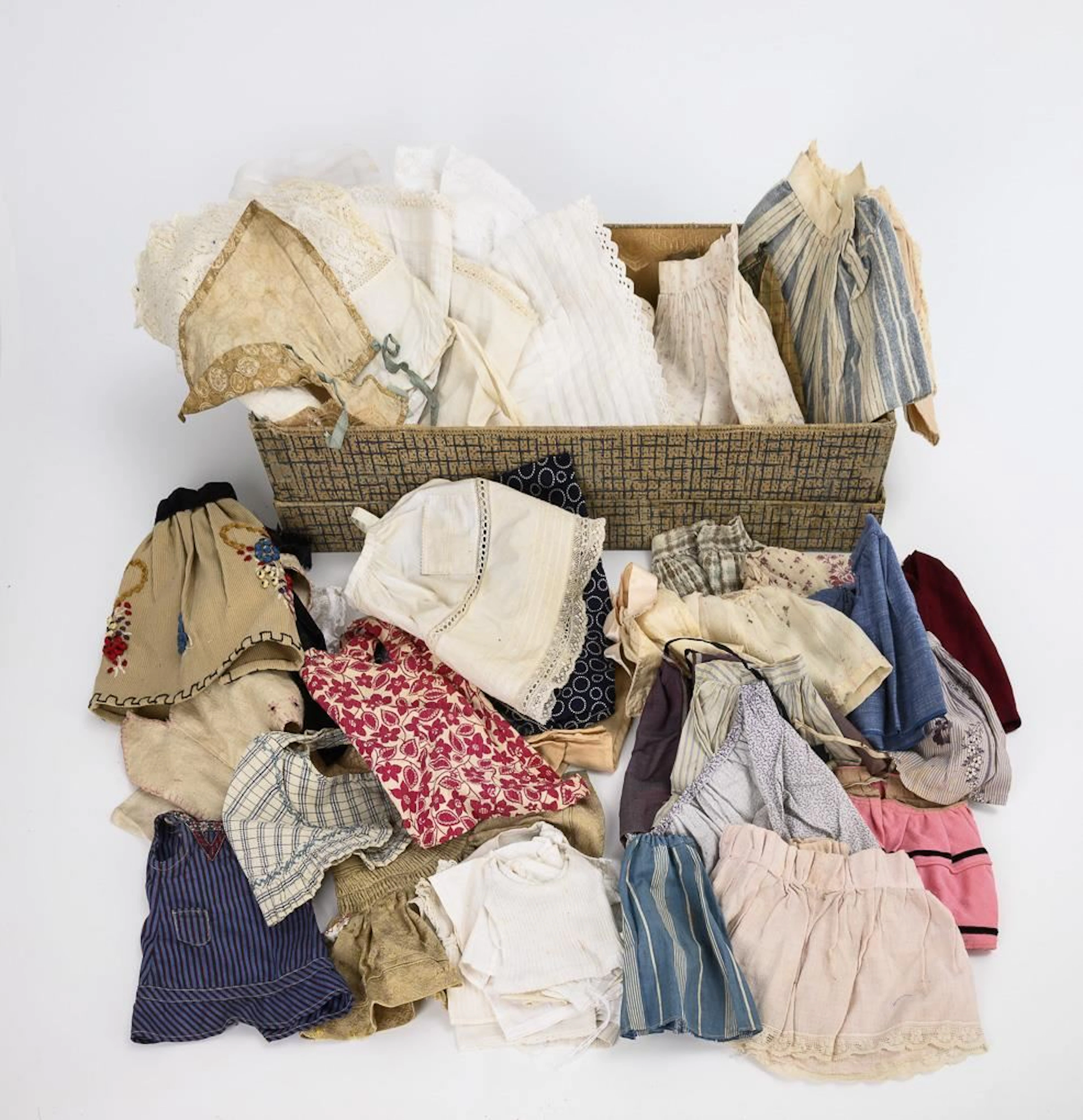 French "Berthe" doll box and assortment of doll clothes.