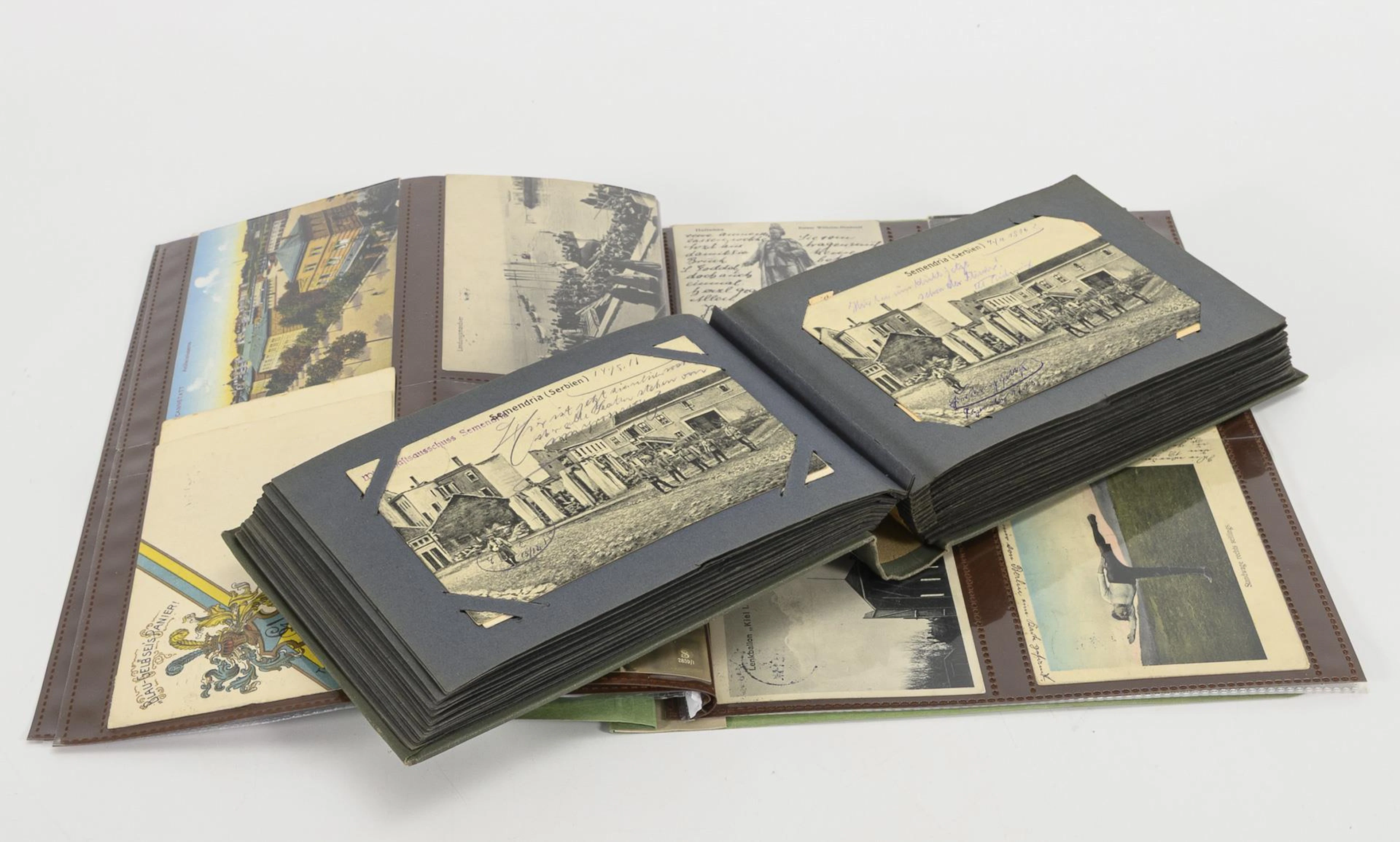 Ca. 132 military postcards, in album and binder