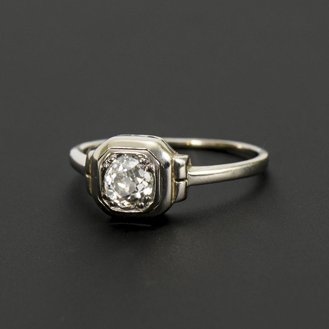 Delicate Art Deco ring with old-cut solitaire.