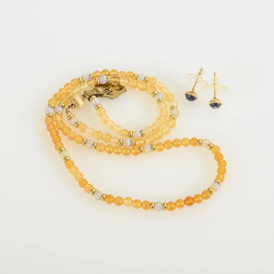 Necklace and earrings with moonstones and fire opals.