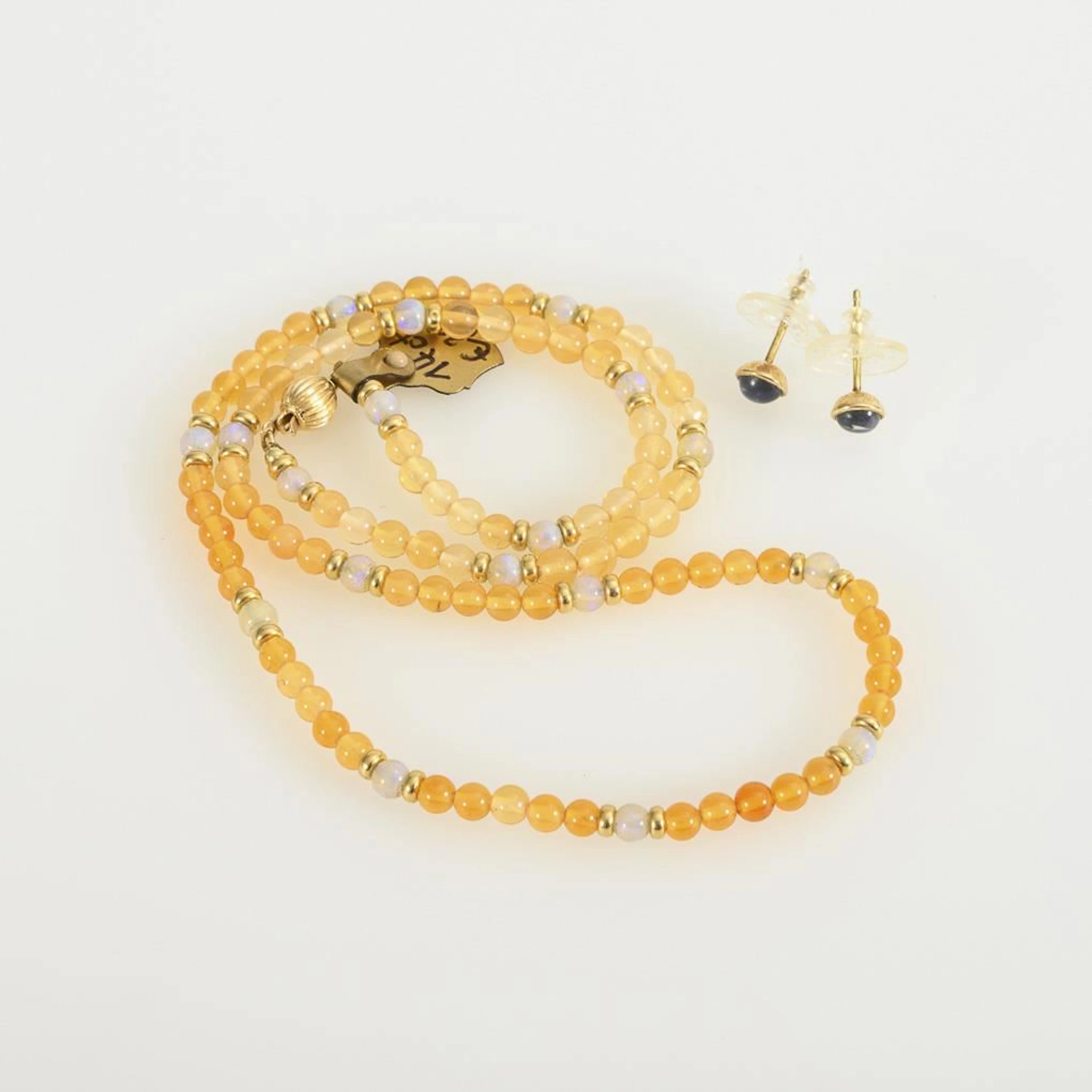Necklace and earrings with moonstones and fire opals.