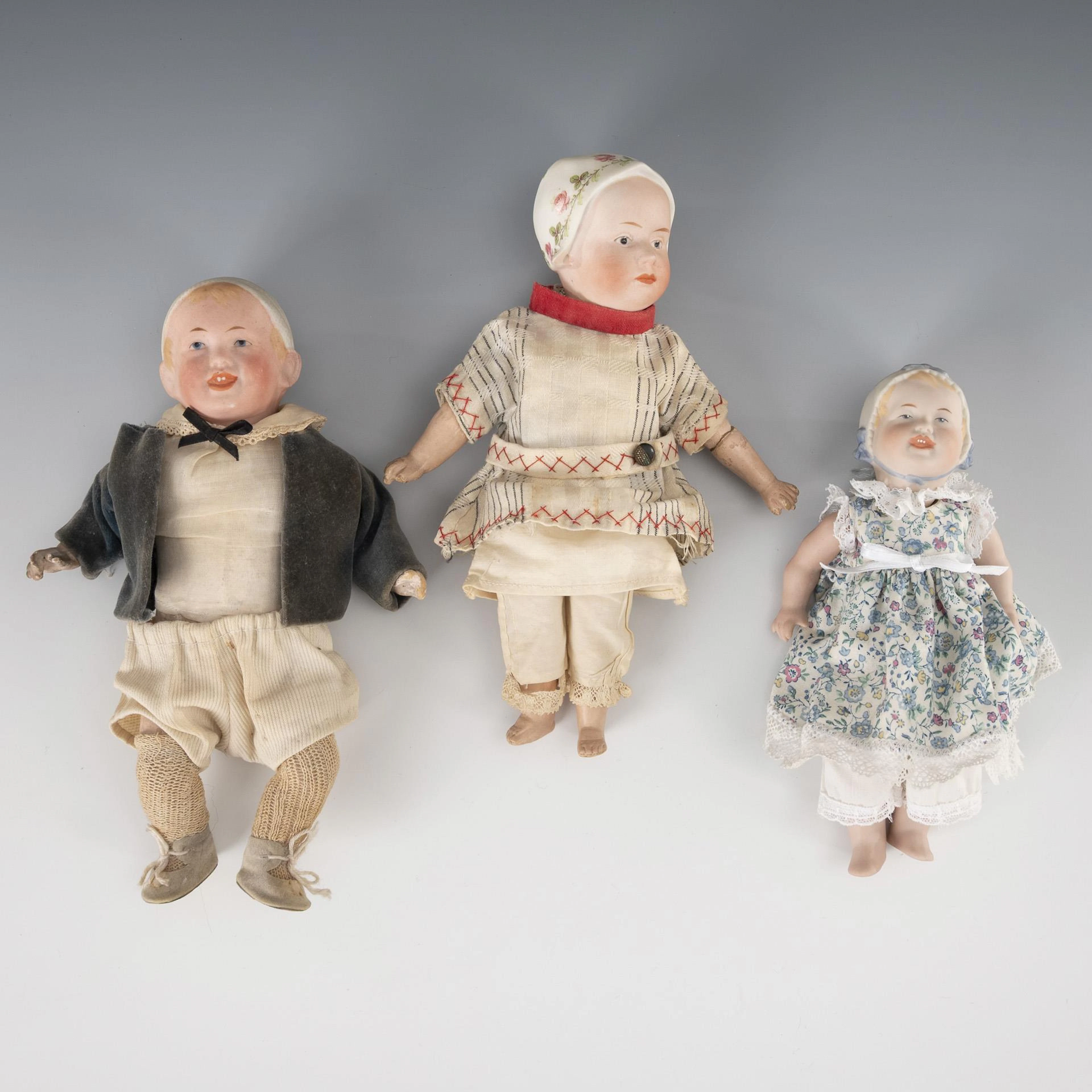 3 small dolls.