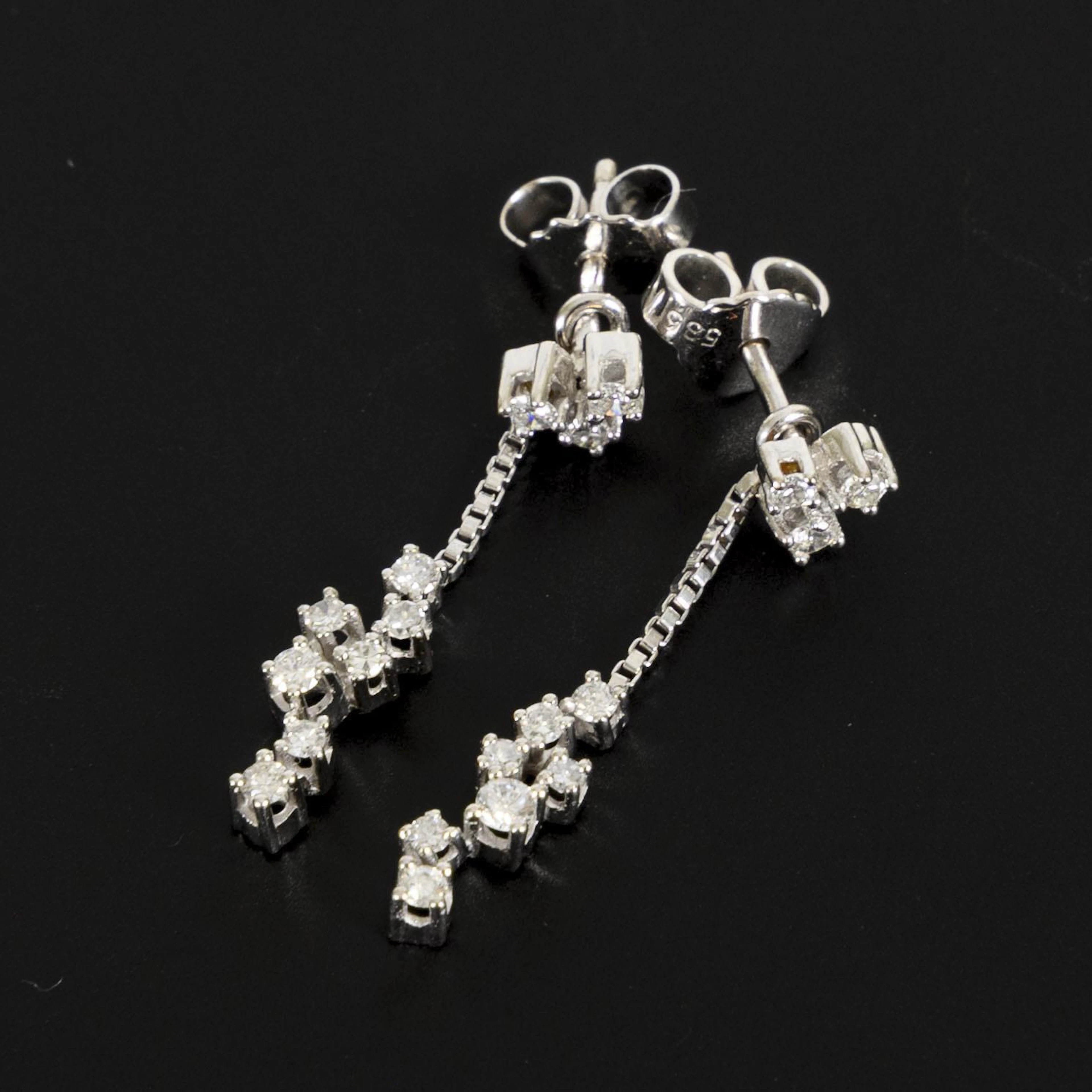 Modern Jour-et-Nuit earrings with diamonds.