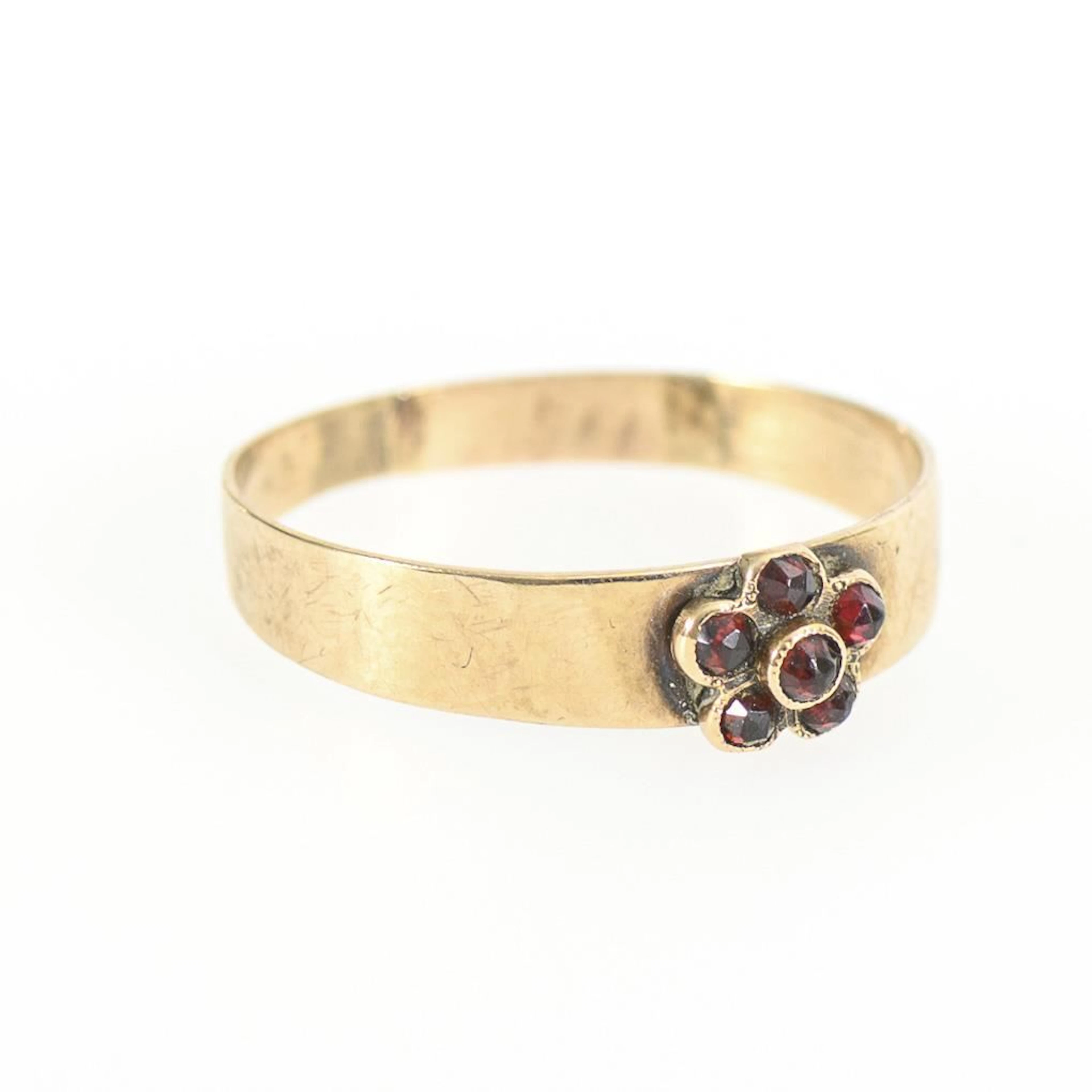 Antique ring with garnet flower.