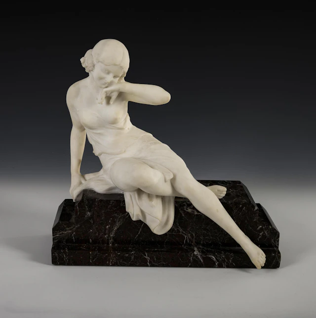 Seductive female figure on a red plinth