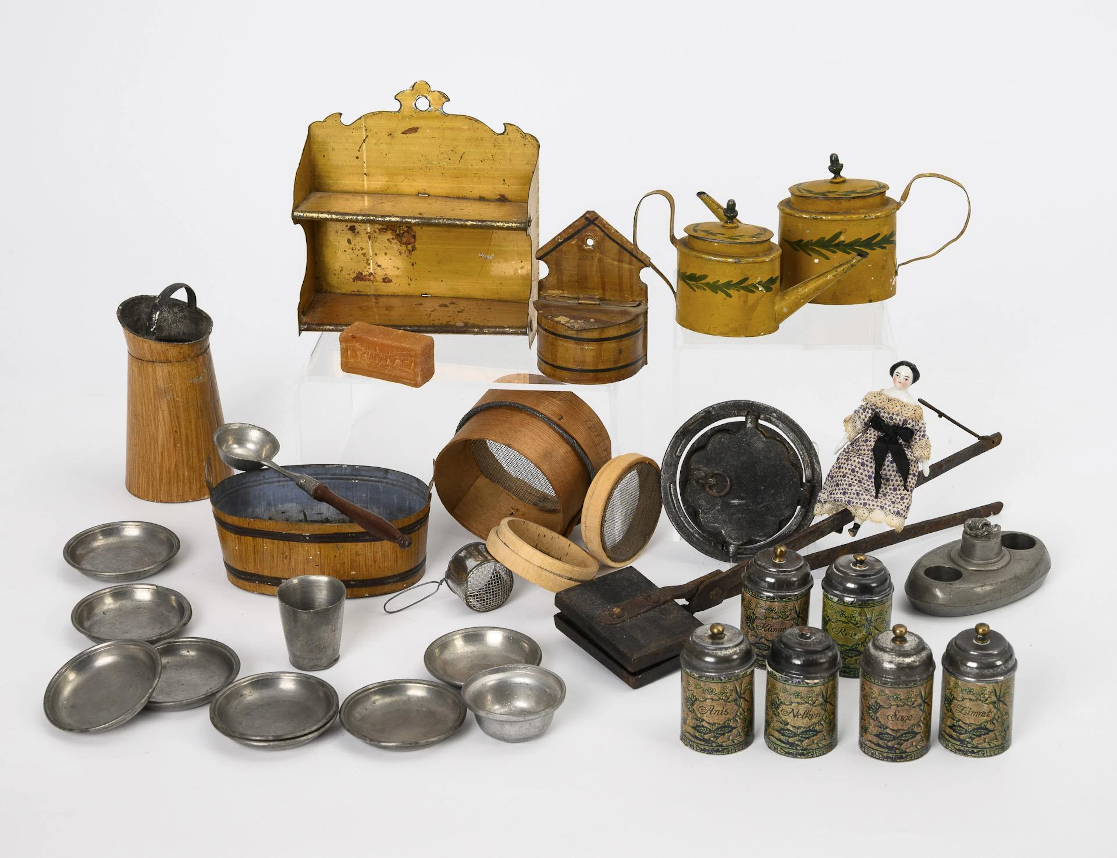 A collection of early kitchen accessories and 1 old doll.