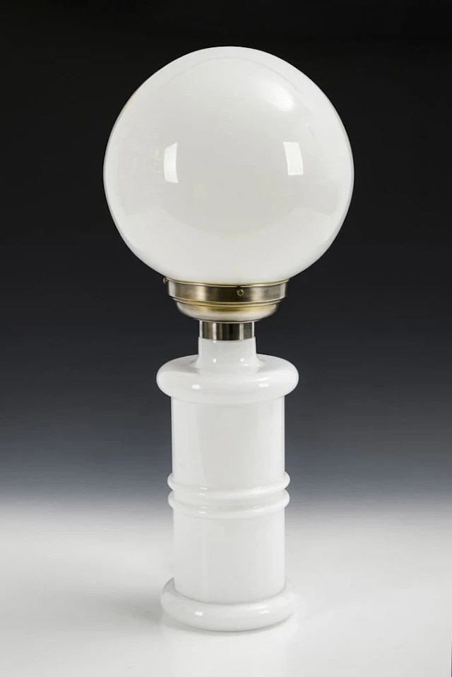 White Art Deco table lamp with a spherical shade.