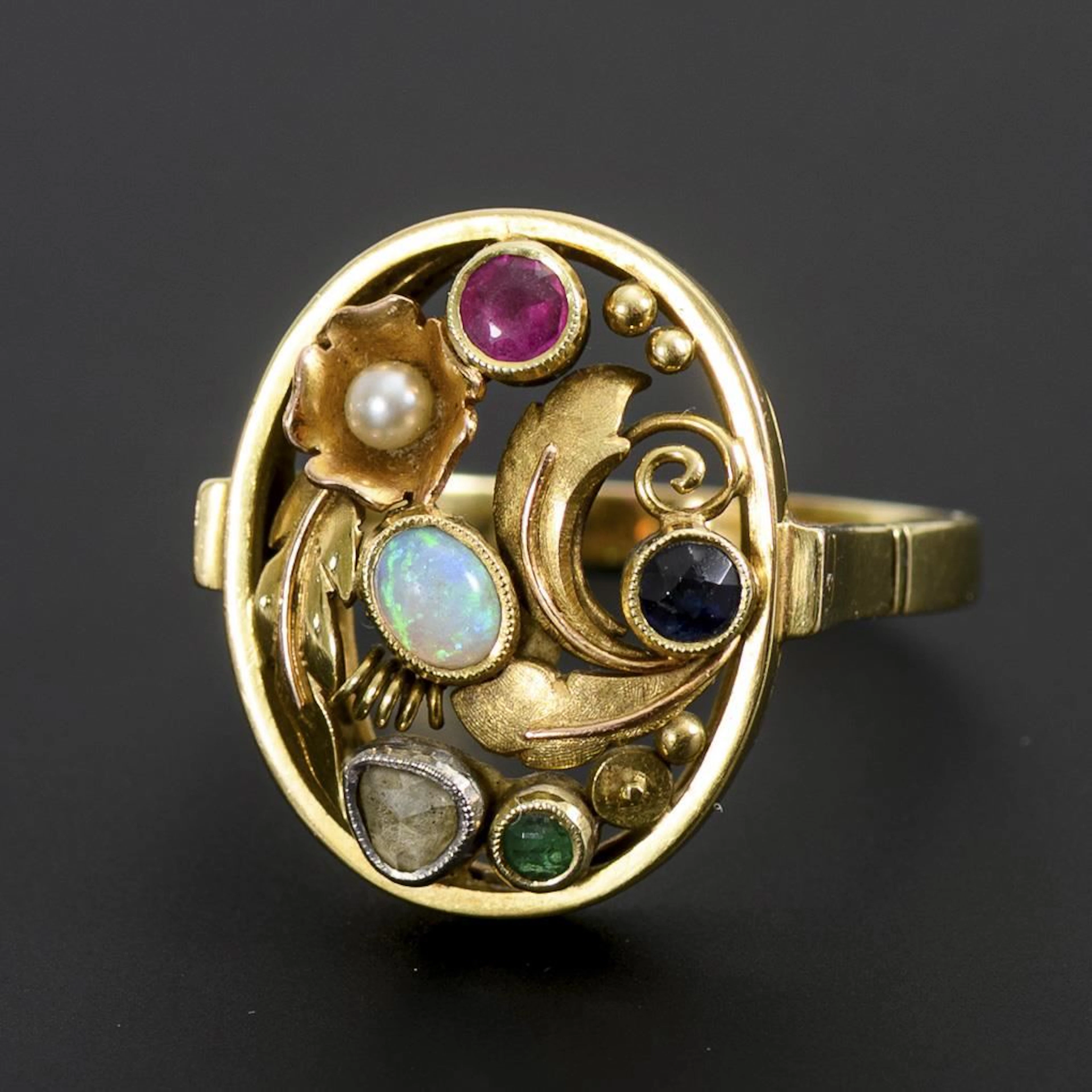 Giardinetto ring with a variety of colored gemstones.