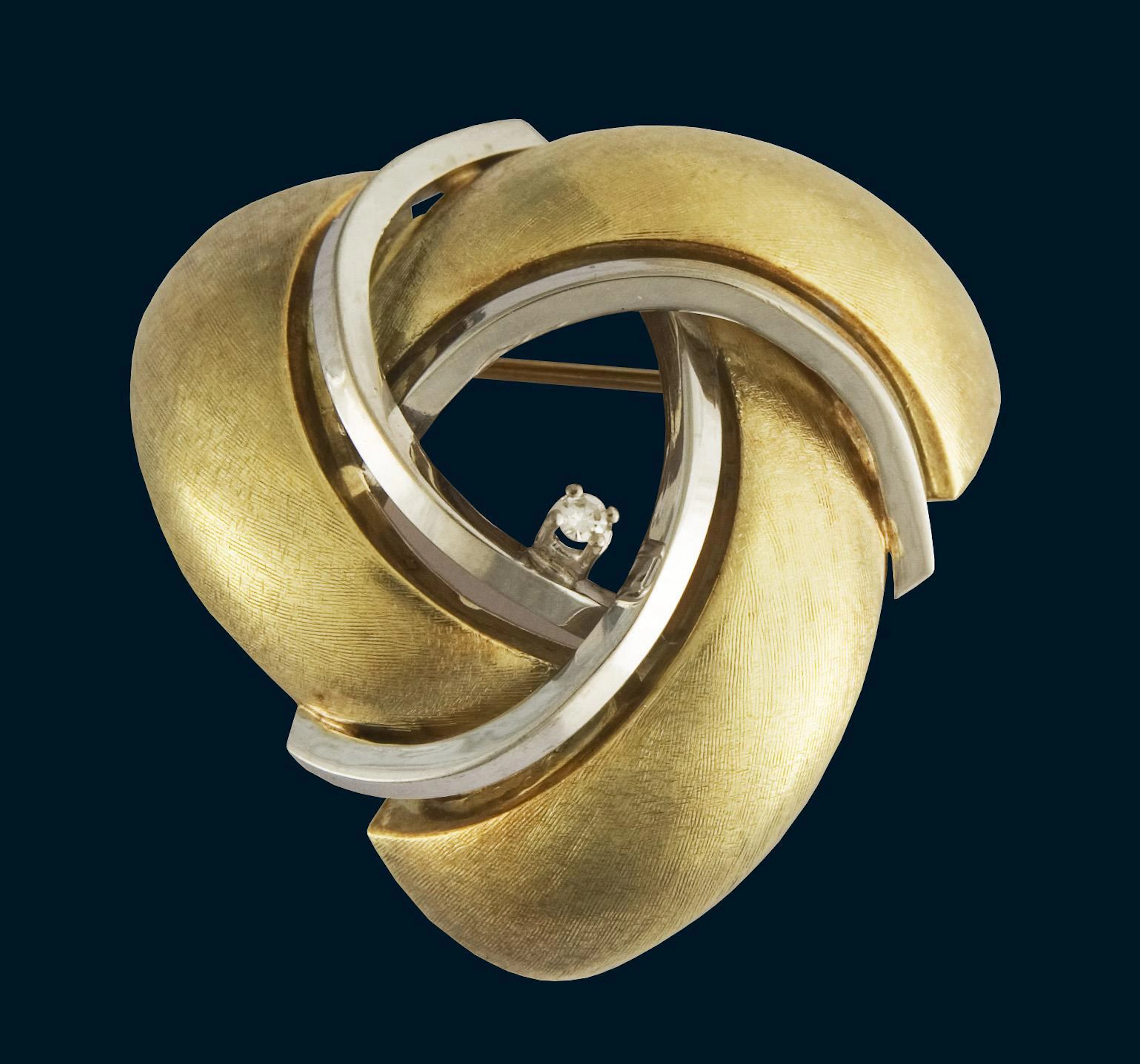 Brooch with small diamond.