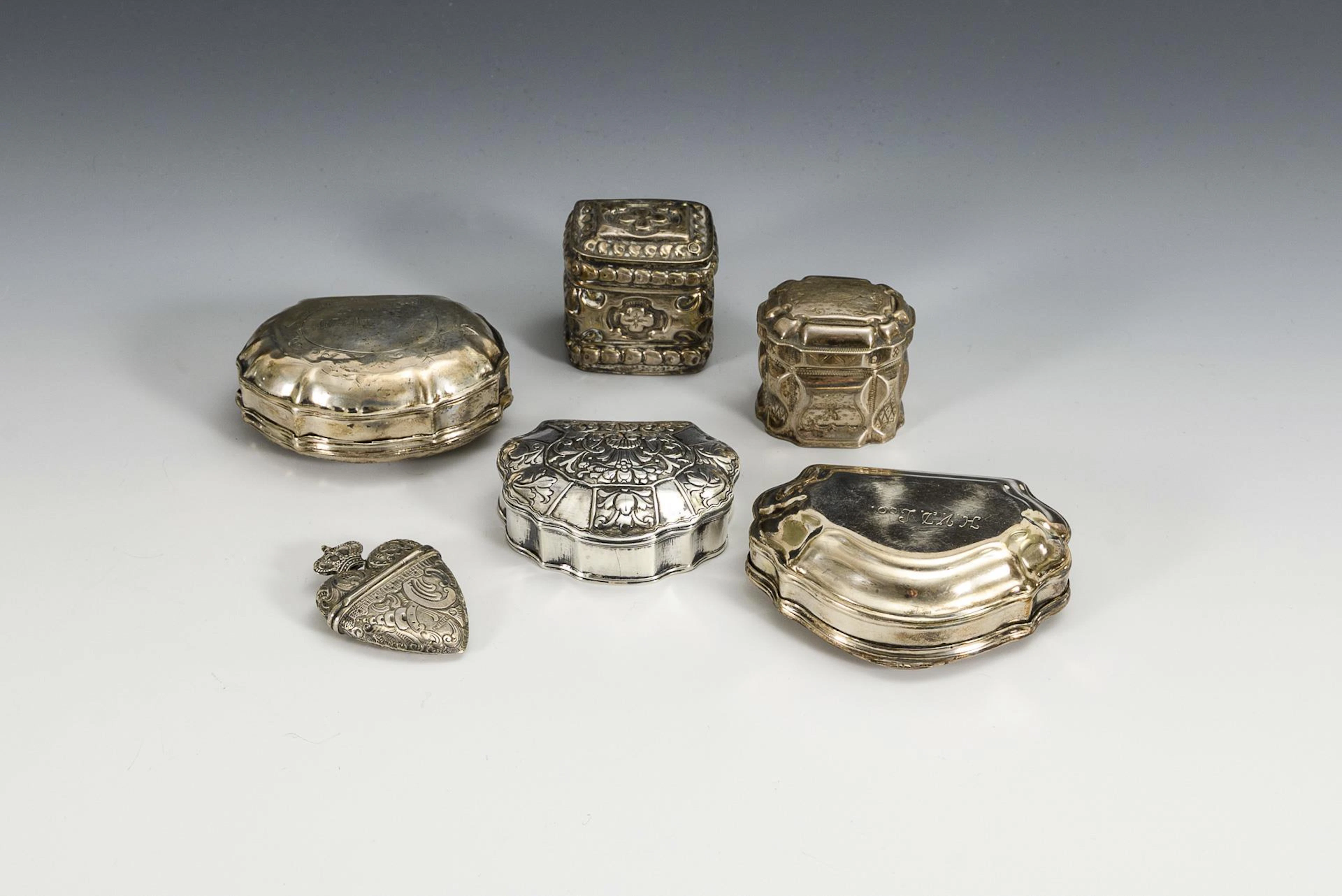 6 silver boxes.