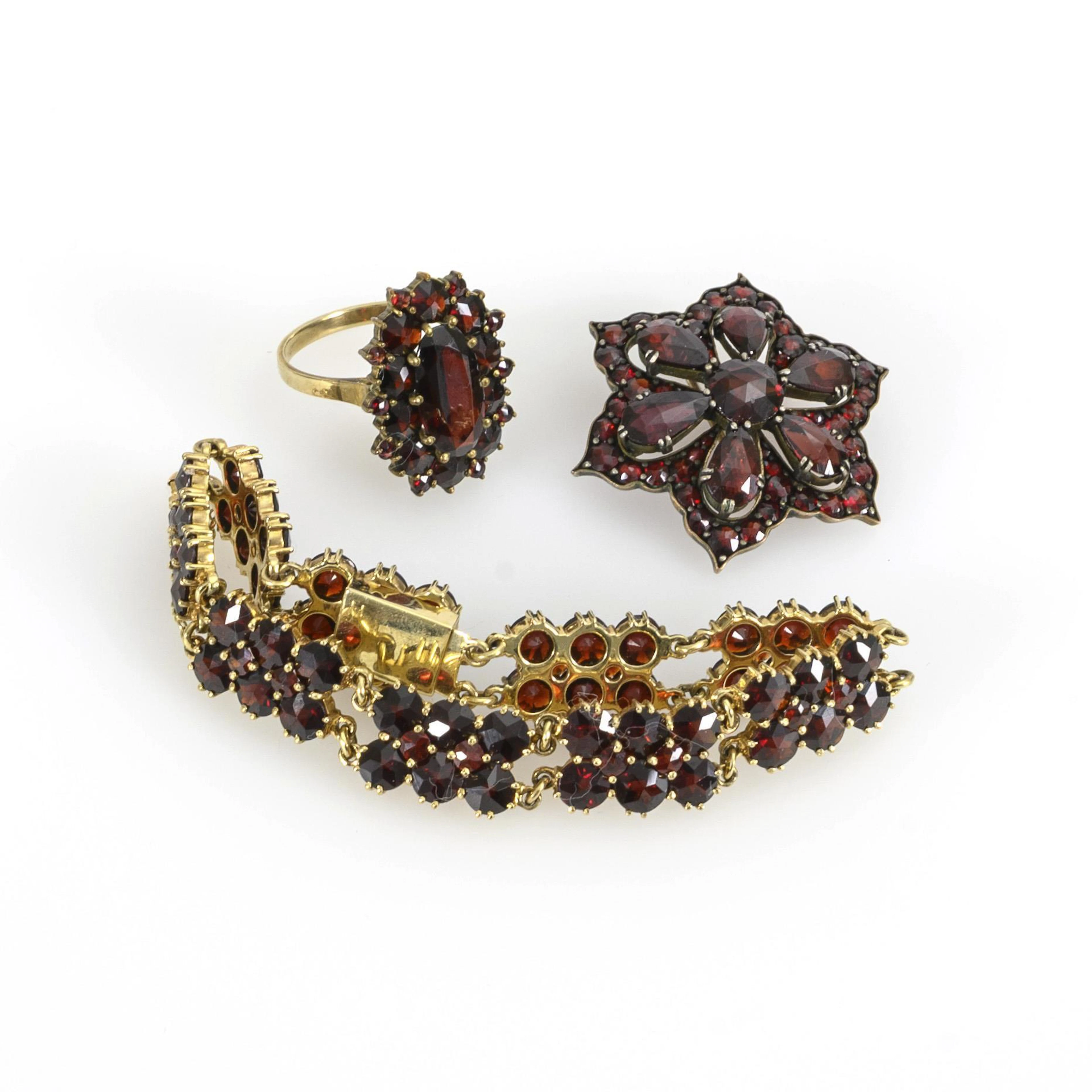 Small ensemble of garnet jewelry.