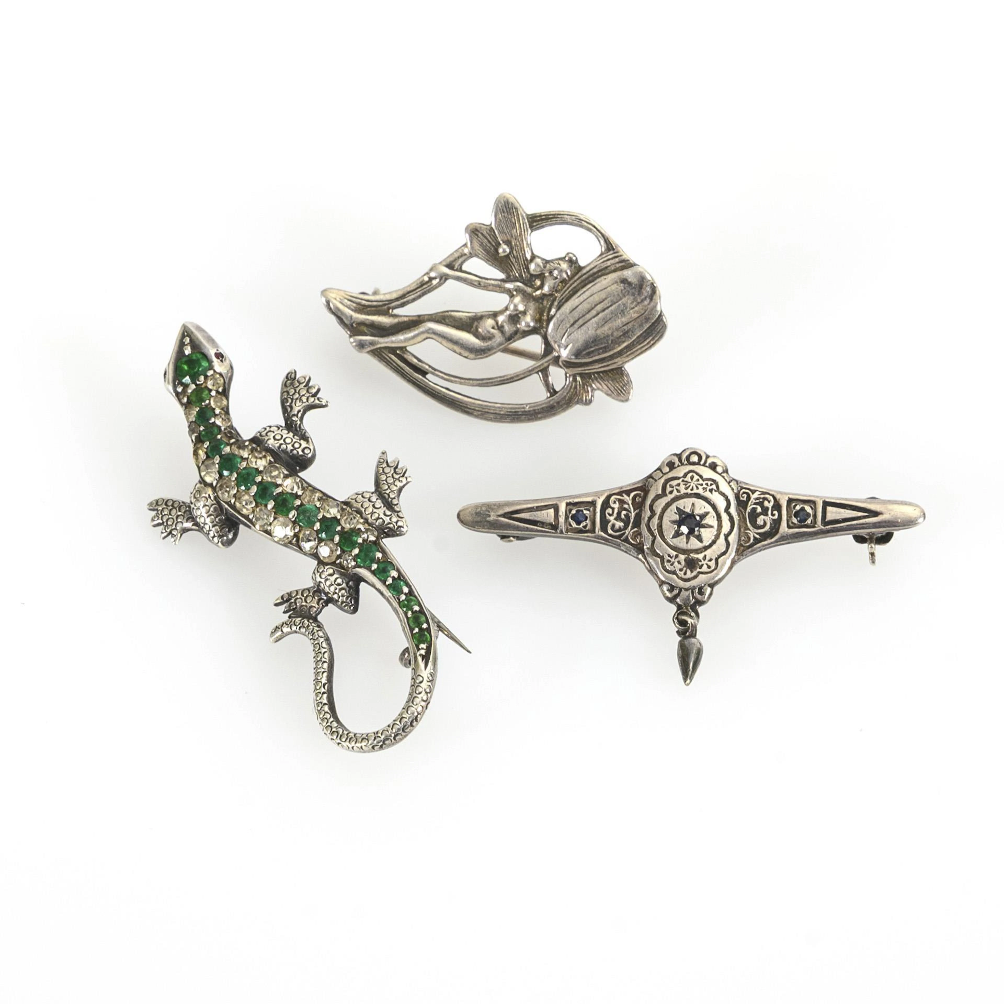 3 older silver brooches.