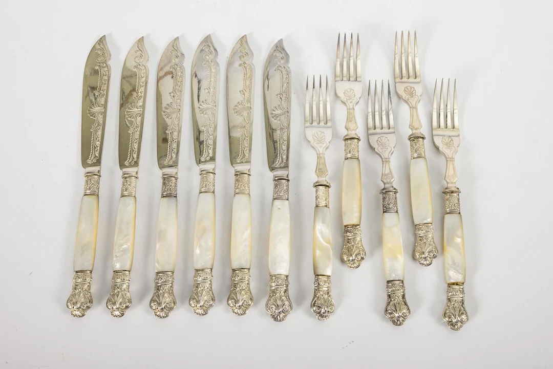 English fish cutlery with mother-of-pearl handles. Plated.
